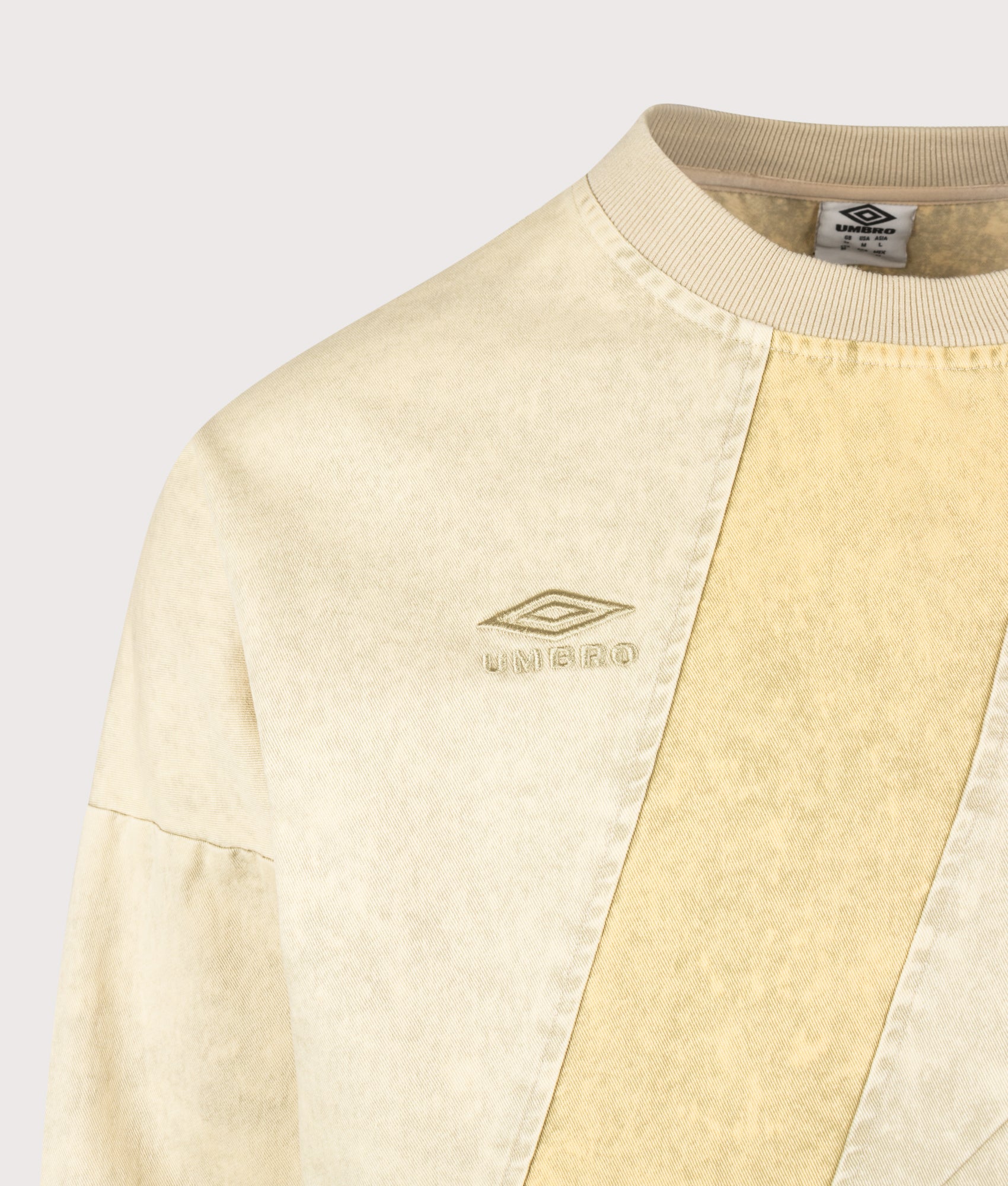 Umbro Relaxed Fit Washed Diamond Drill Sweatshirt in Dust and Gray Green at EQVVS Menswear. Detail shot.