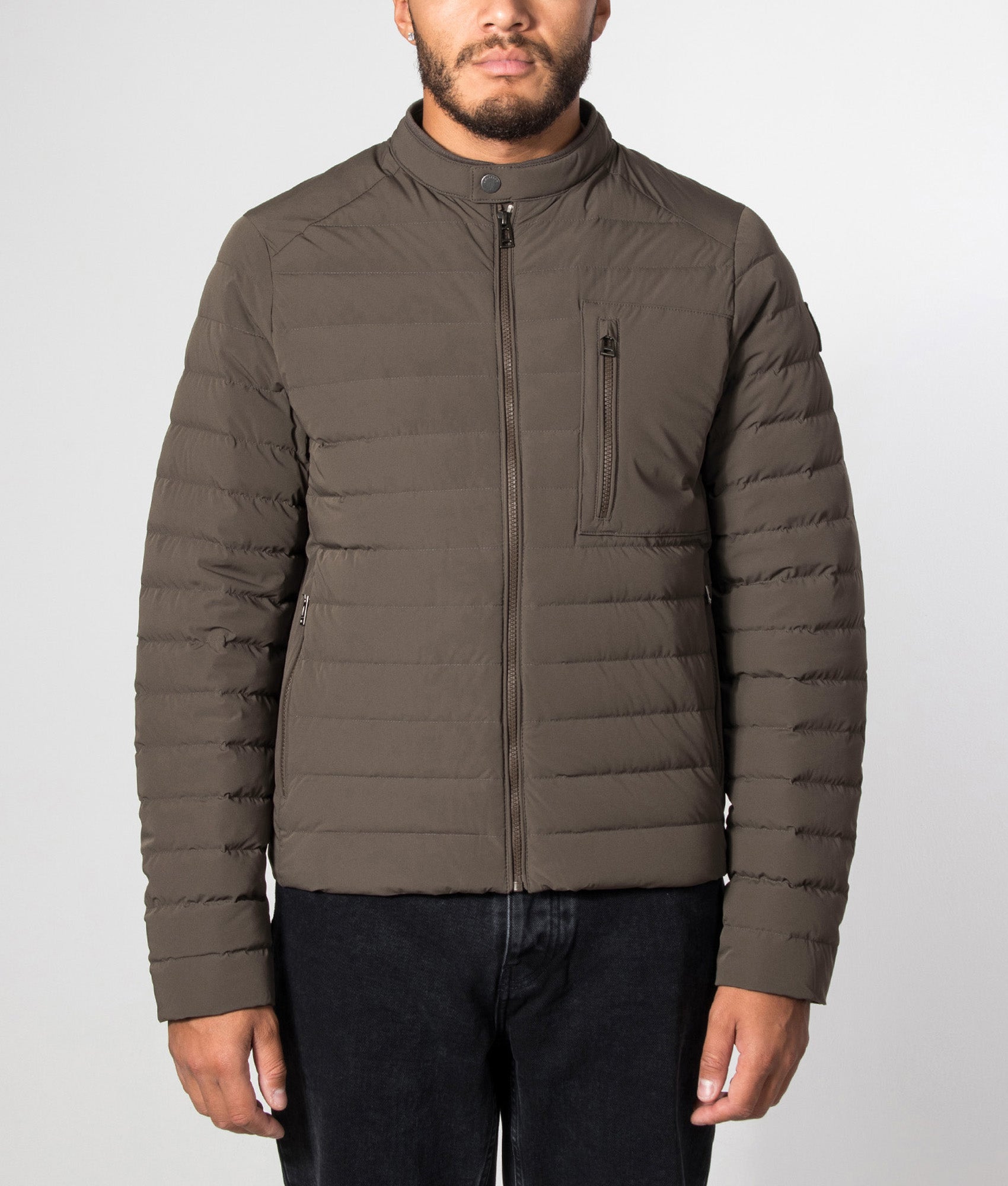 Belstaff Regular Fit Chassis Jacket in Army Olive at EQVVS Menswear. model front shot.