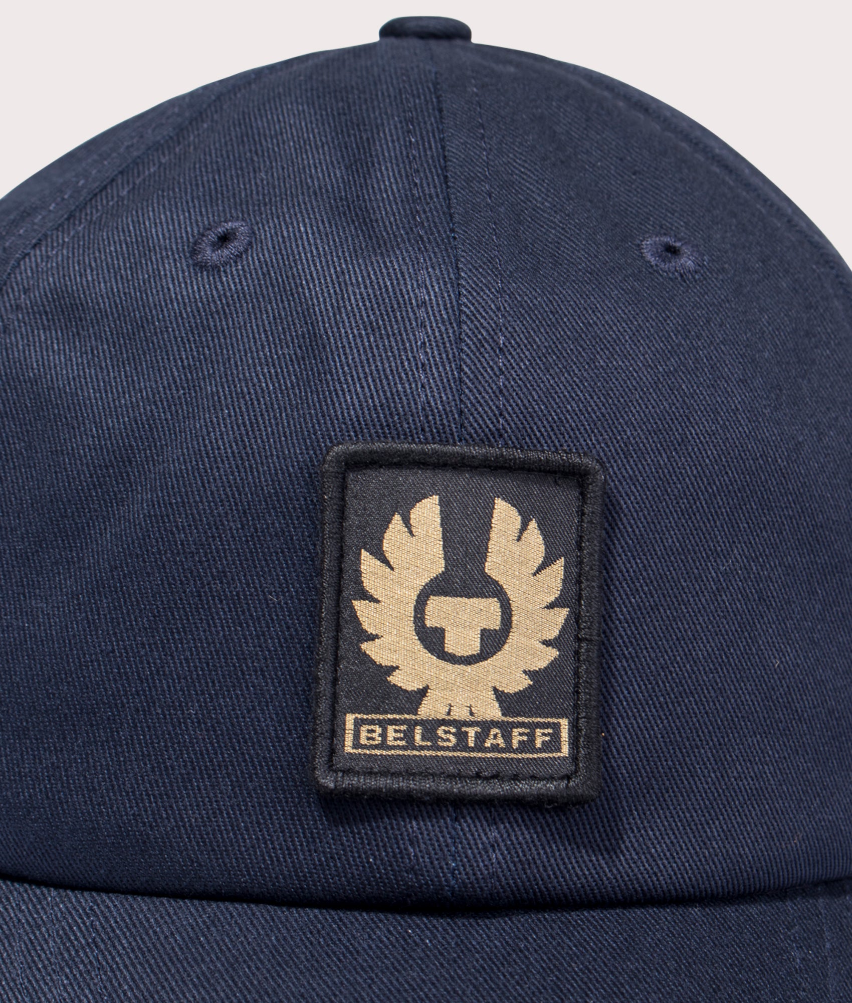 Belstaff Phoenix Logo Cap in Navy at EQVVS Menswear. Detail shot.