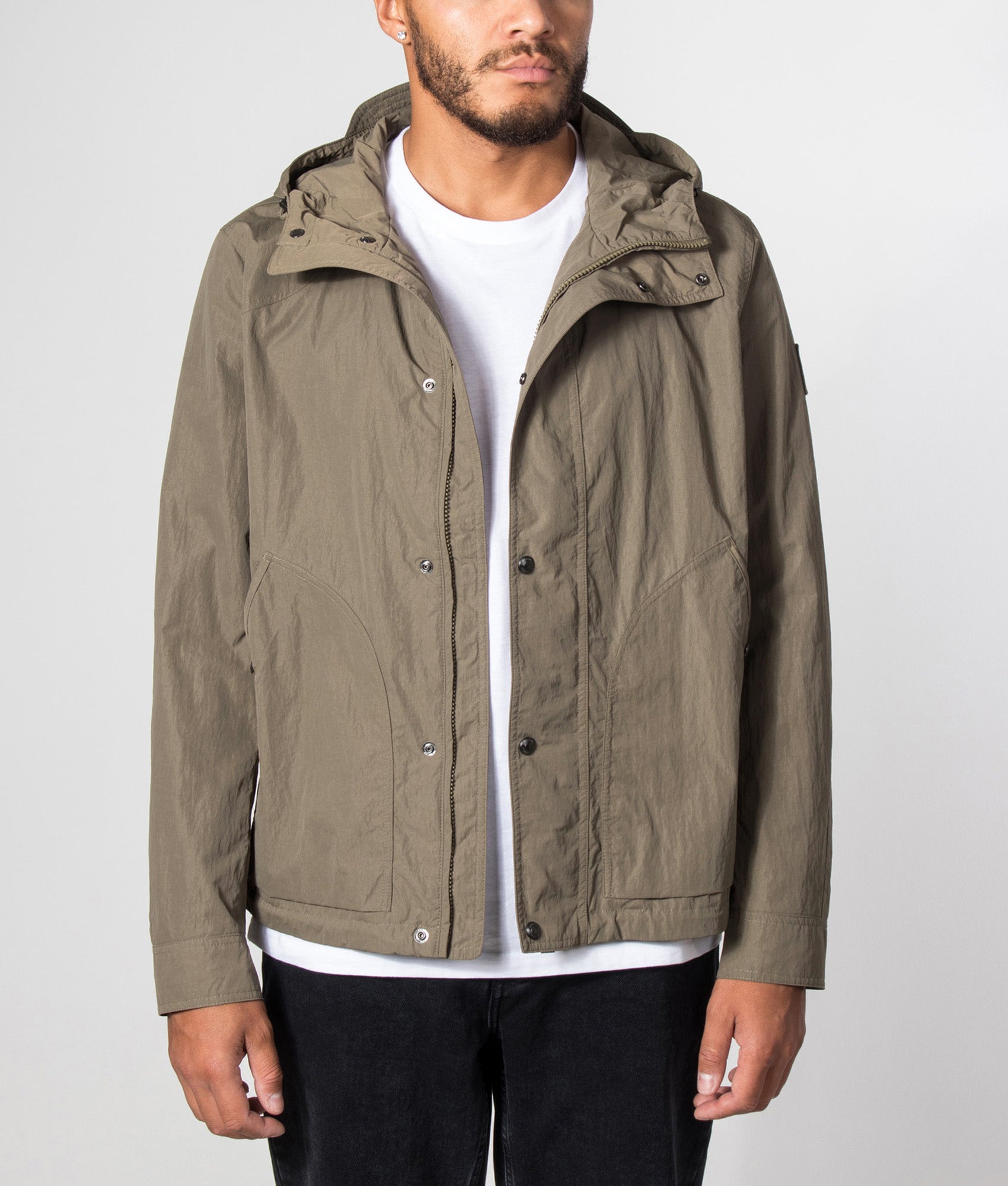 Belstaff Regular Fit Marsh Jacket in Khaki Green at EQVVS Menswear. Model front shot.