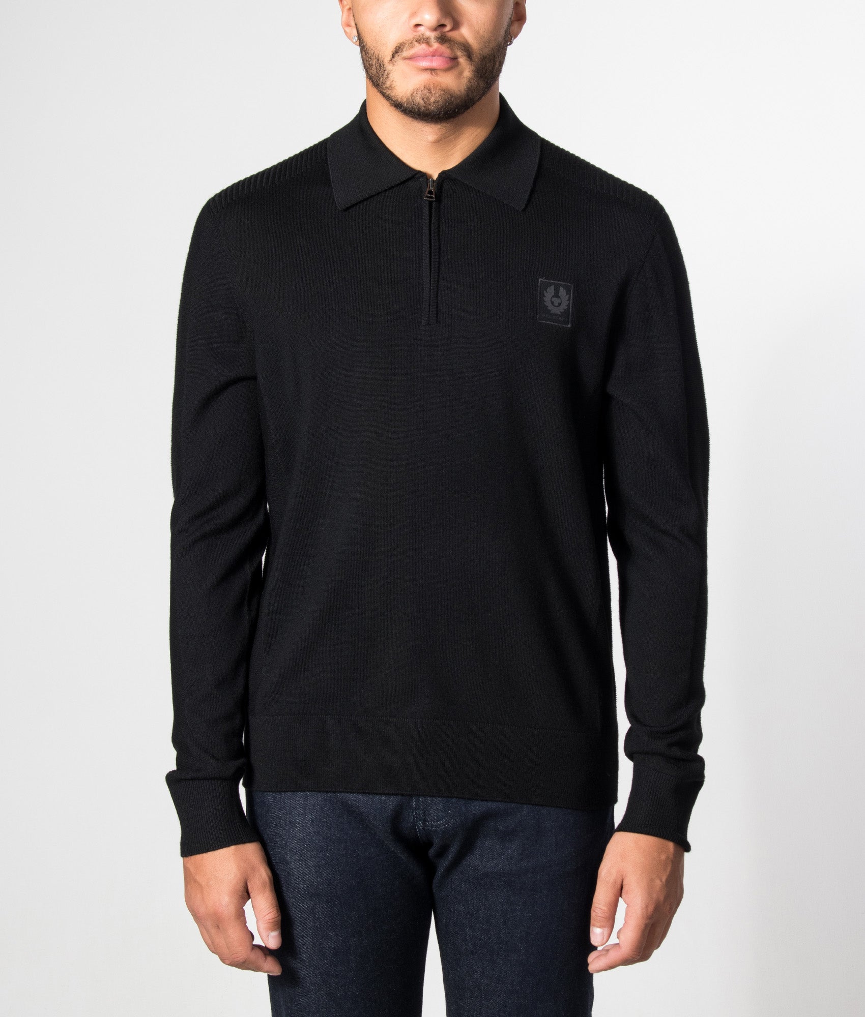 Belstaff Regular Fit Colden Knitted Polo Shirt in Black at EQVVS Menswear. Model front shot.