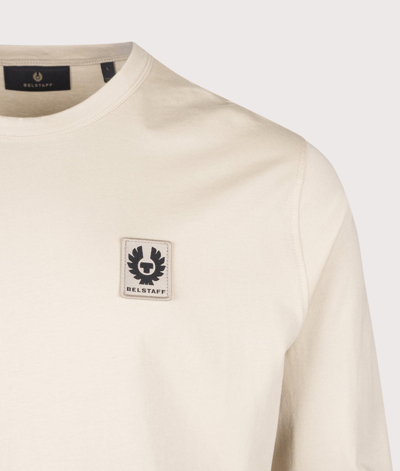 Belstaff Regular Fit Belstaff Long Sleeved T-Shirt in Pale Stone at EQVVS Menswear. Detail shot.