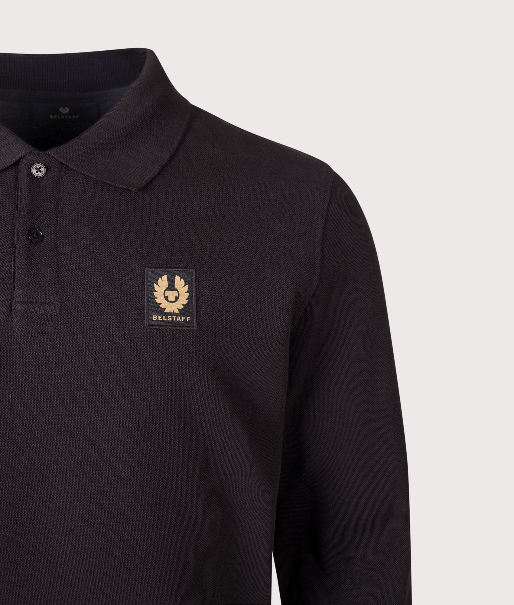 Belstaff Regular Fit Belstaff Long Sleeved Polo Shirt in Black at EQVVS Menswear. Detail shot.