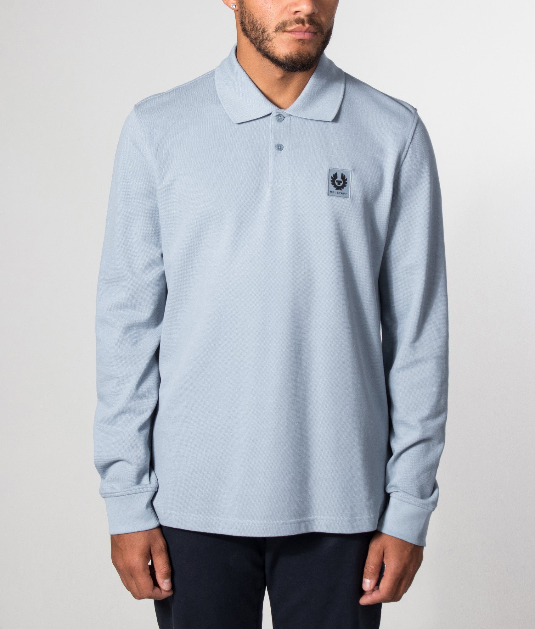 Belstaff Regular Fit Belstaff Long Sleeved Polo Shirt in Mist Blue at EQVVS Menswear. Model front shot.