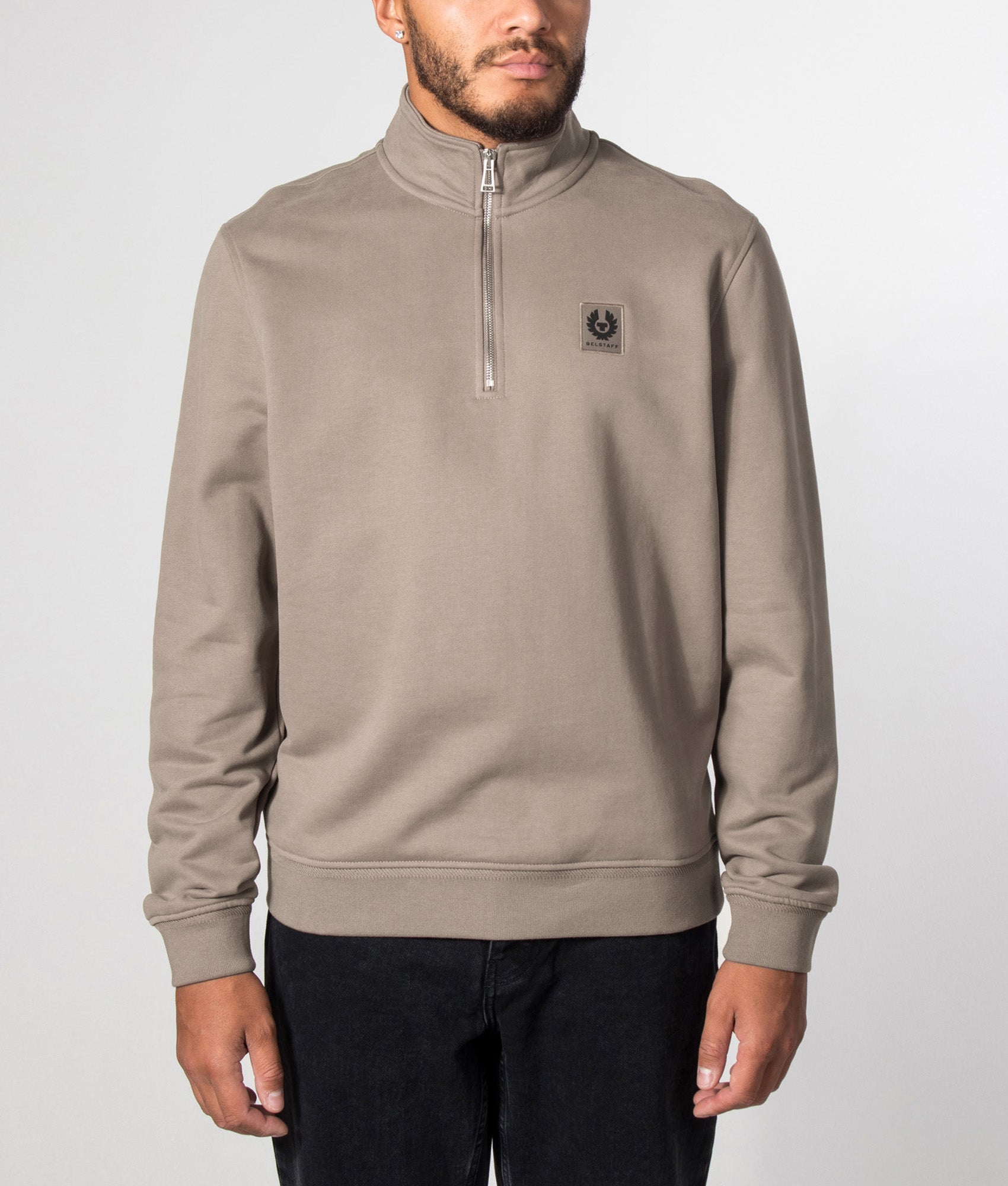 Belstaff Regular Fit Belstaff Quarter Zip Sweatshirt in Dusty Taupe at EQVVS Menswear. Model front shot.