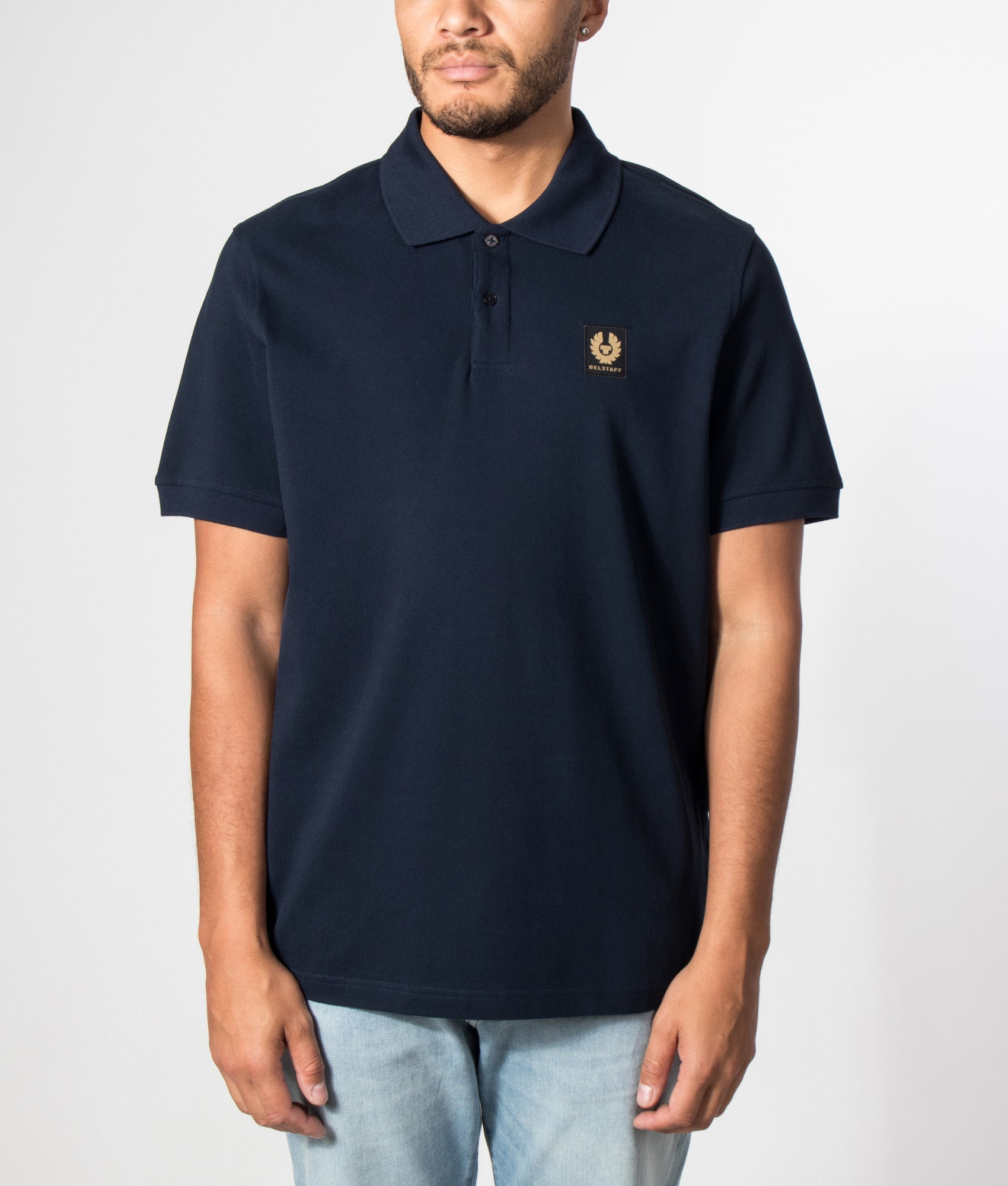 Belstaff Regular Fit Belstaff Polo Shirt in Dark Ink at EQVVS Menswear. Model front shot.
