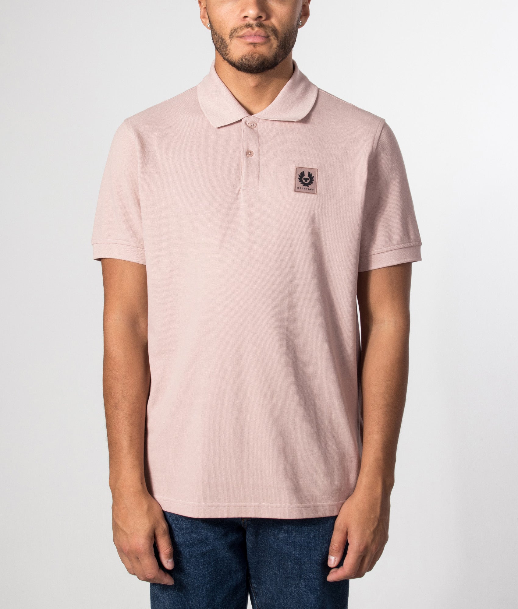 Belstaff Regular Fit Belstaff Polo Shirt in Dusk Pink at EQVVS Menswear. Model front shot.