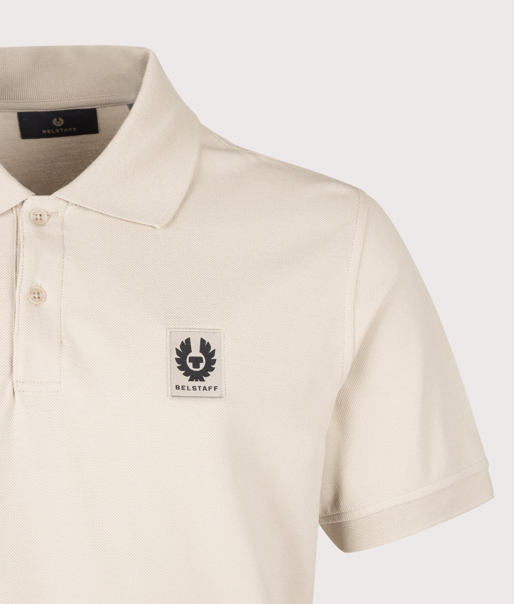 Belstaff Regular Fit Belstaff Polo Shirt in Pale Stone at EQVVS Menswear. Detail shot.