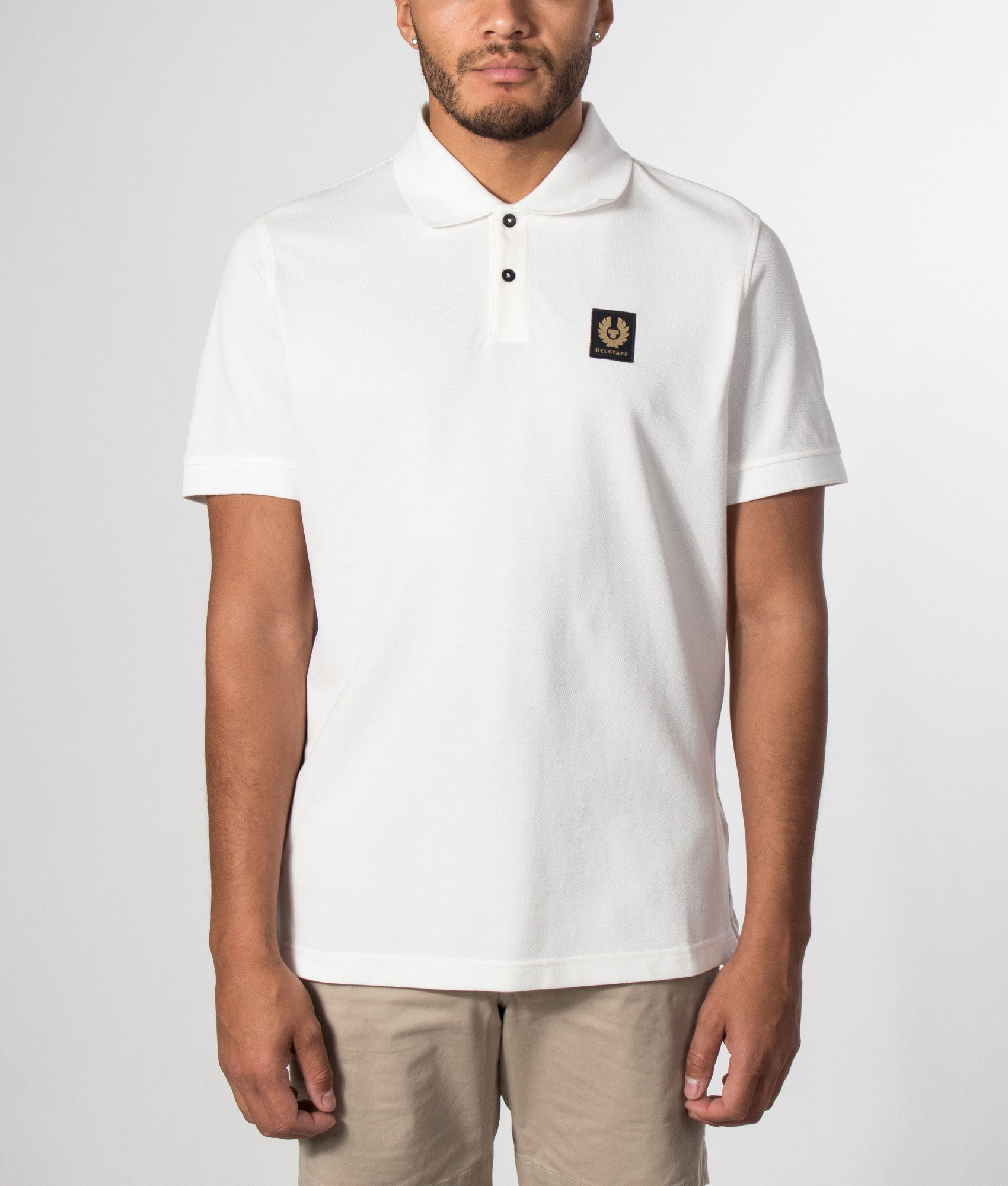 Belstaff Regular Fit Belstaff Polo Shirt in White at EQVVS Menswear. Model front shot.