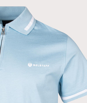 Belstaff Graph Zip Polo Shirt in skyline blue with zip detail logo shot at EQVVS
