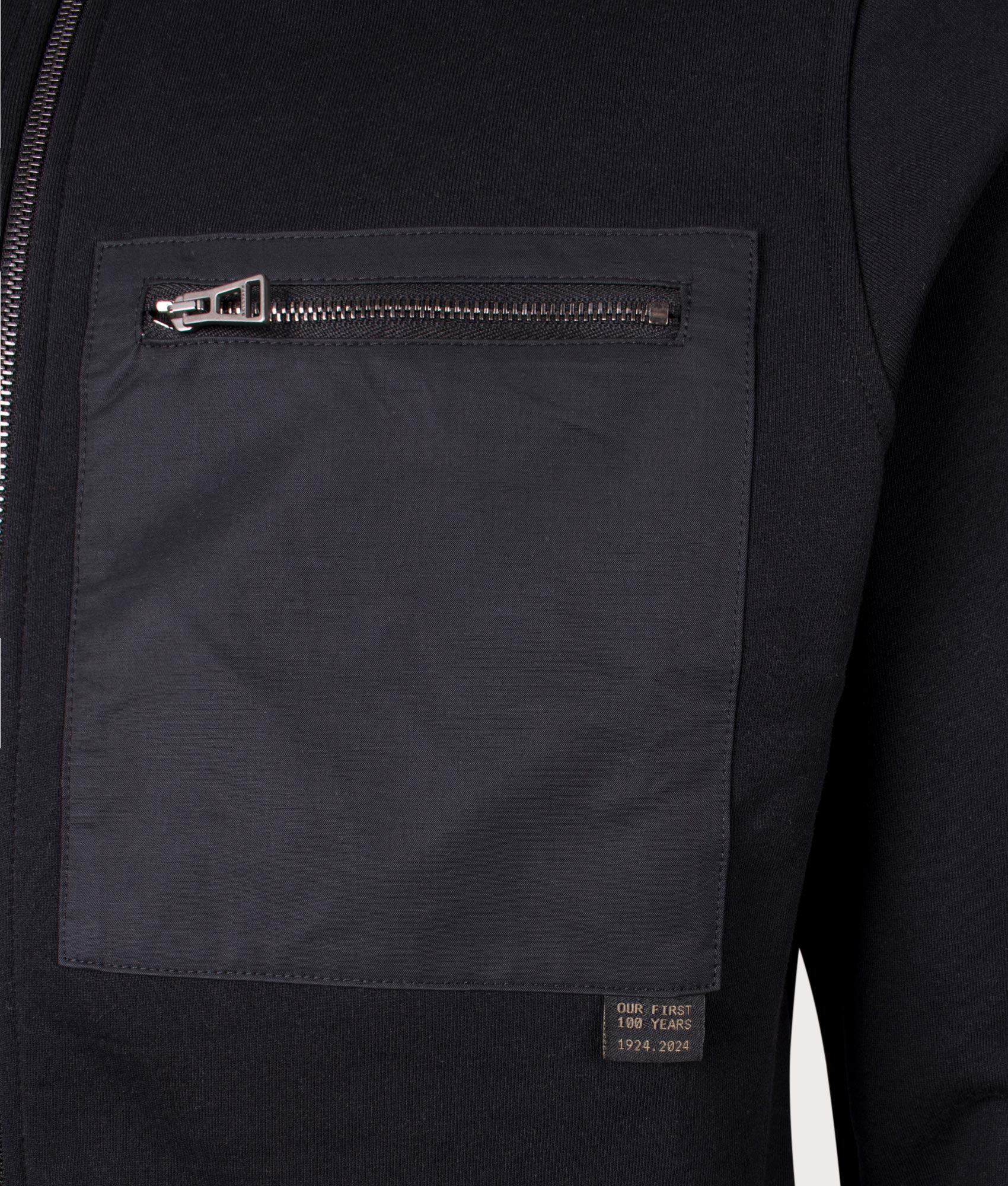 Belstaff Centenary Full Zip Sweatshirt in Black, 100% cotton at EQVVS. Detailed pocket shot. 