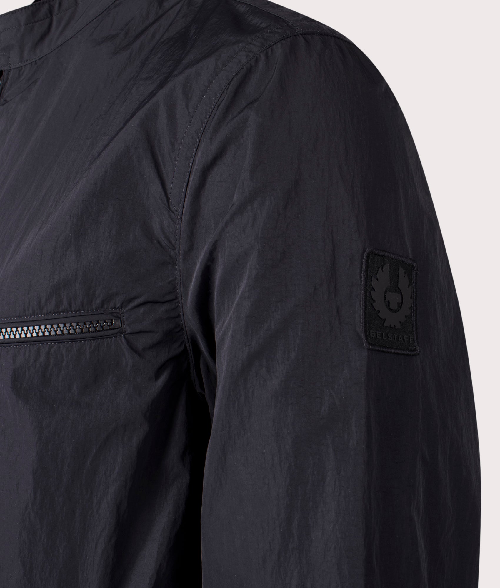 Belstaff Walkham Jacket in Black at EQVVS. Detailed logo shot. 