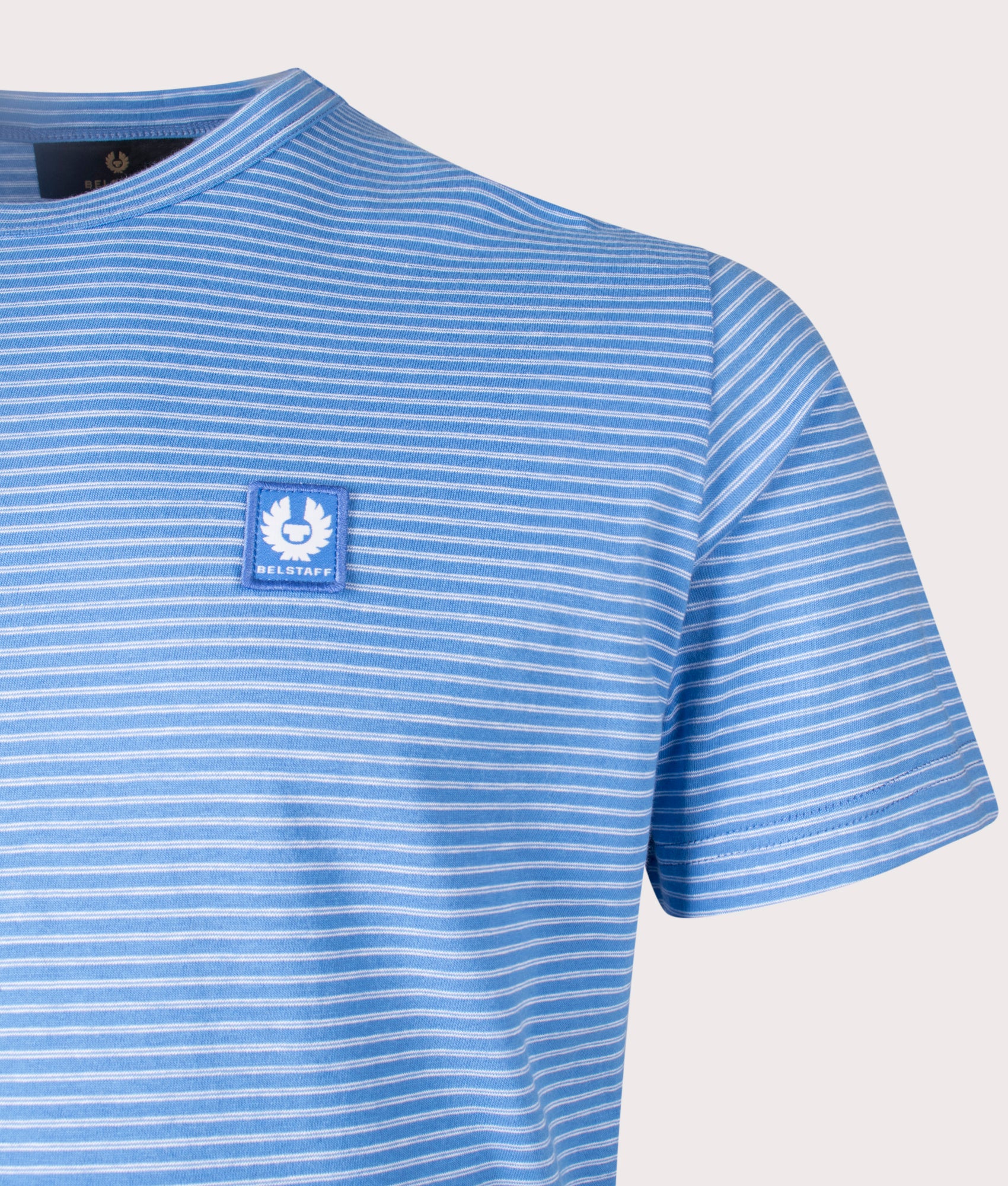 Belstaff Micro Striped T-Shirt in Hydra Blue, 100% cotton at EQVVS. Detailed logo shot. 