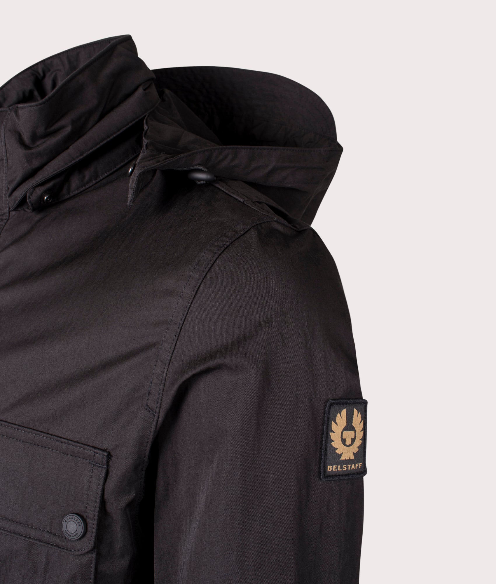 Belstaff Drome Jacket in Black. At EQVVS Menswear. Front angle logo shot