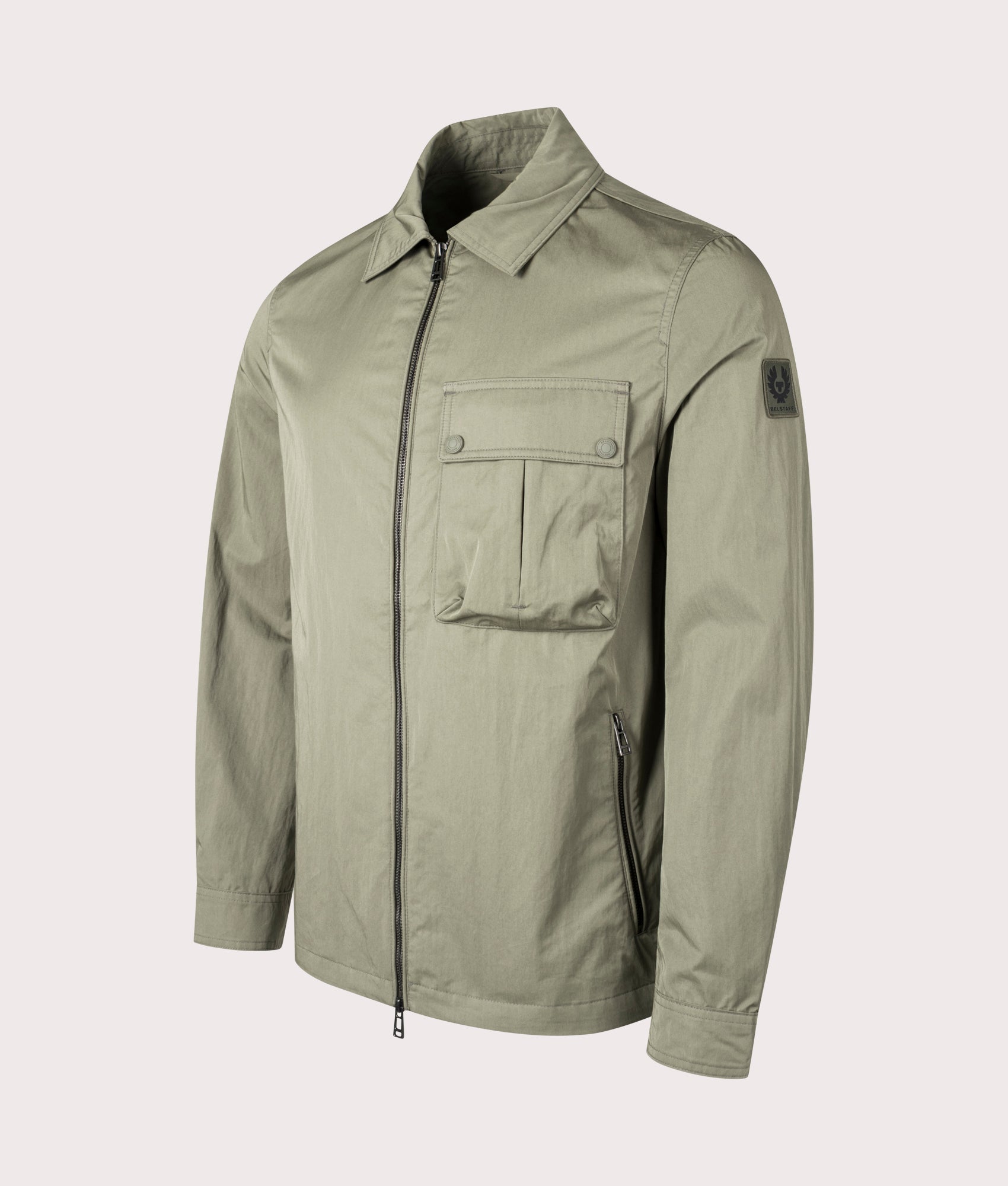 Belstaff Drome Overshirt in Surplus Green, Cotton/Nylon blend. At EQVVS Menswear. Front angle detail shot