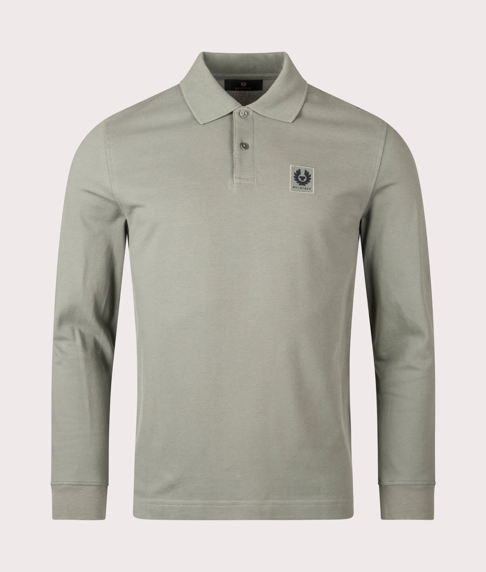 Belstaff Long Sleeved Polo Shirt in Sage Green. 100% Cotton | Belstaff | Shot at EQVVS | Front shot 