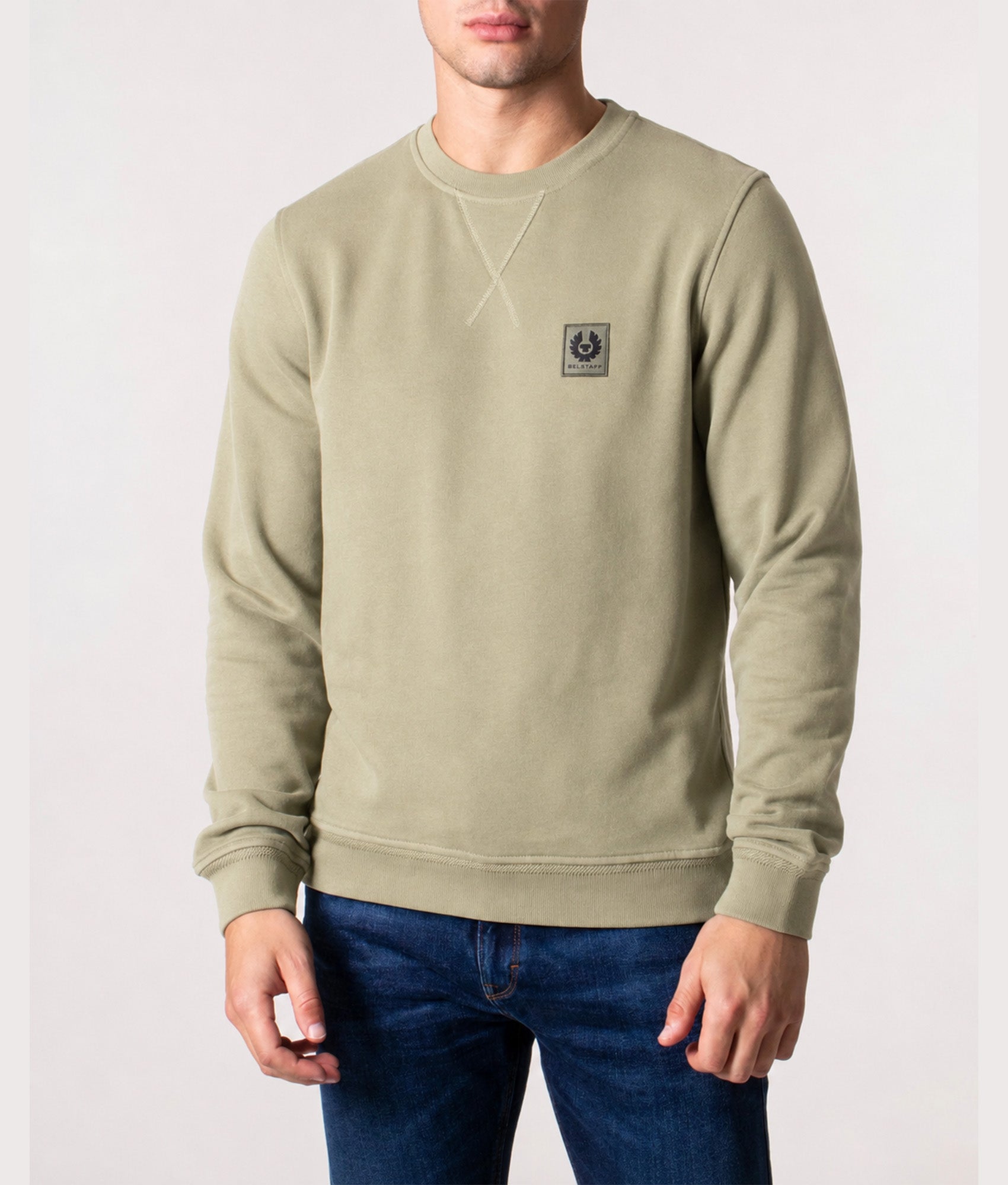 Belstaff sweatshirt in Fatigue Green at EQVVS Menswear. Model front shot.