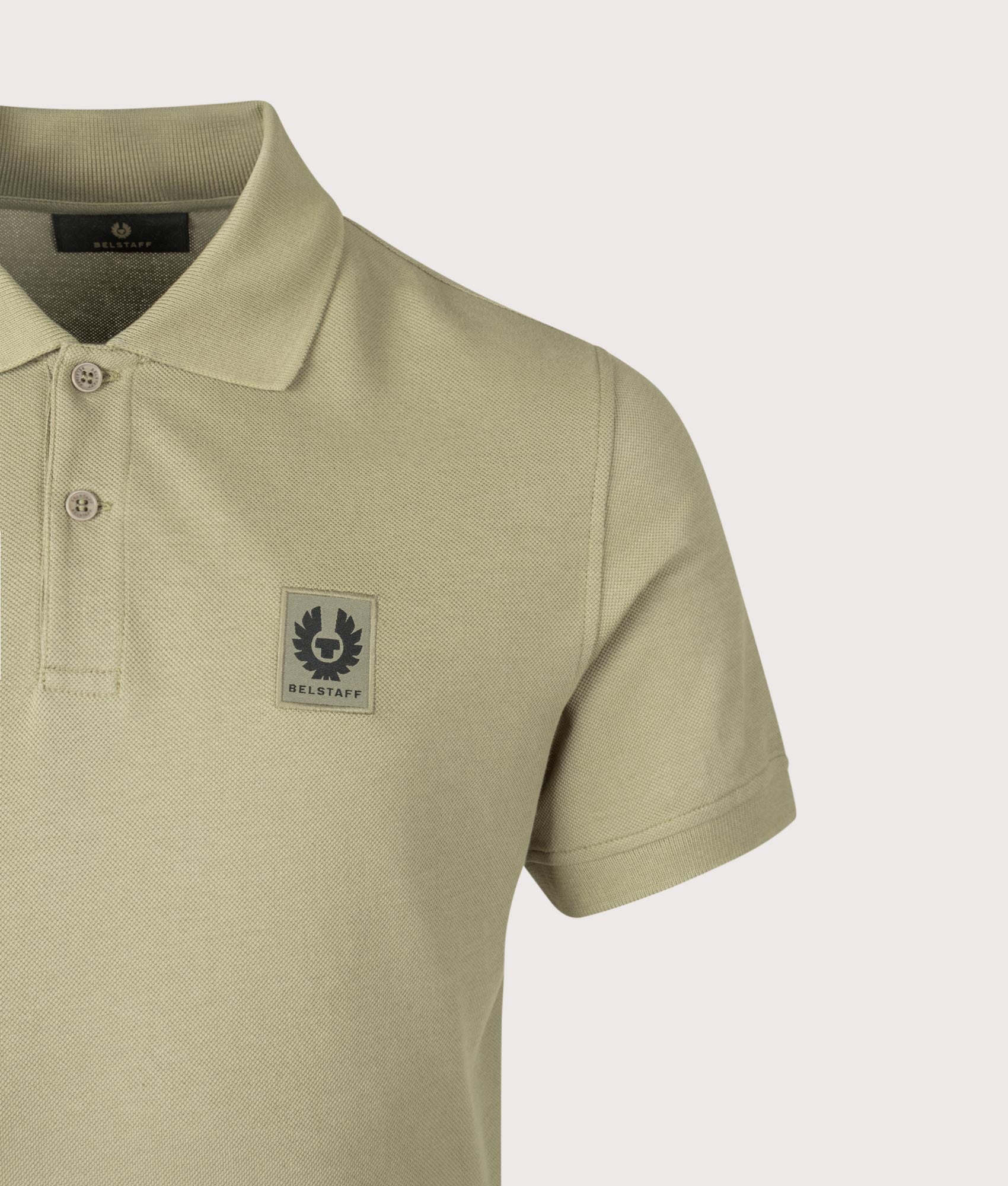 Belstaff Polo Shirt in Fatigue Green at EQVVS Menswear. Detail shot.
