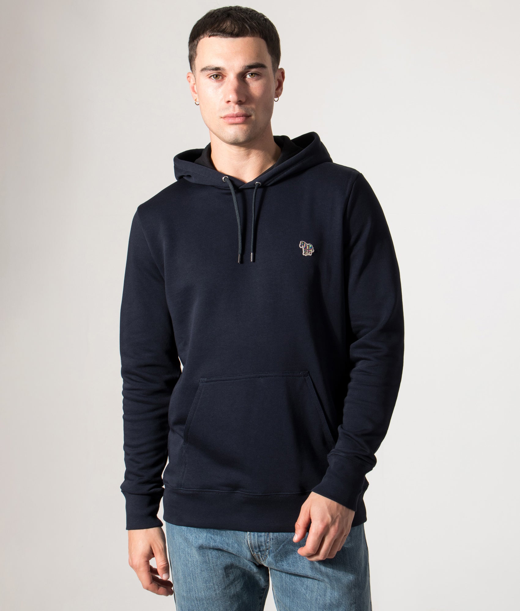 PS Paul Smith Zebra Logo Hoodie in Very Dark Navy at EQVVS Menswear. Model front shot.