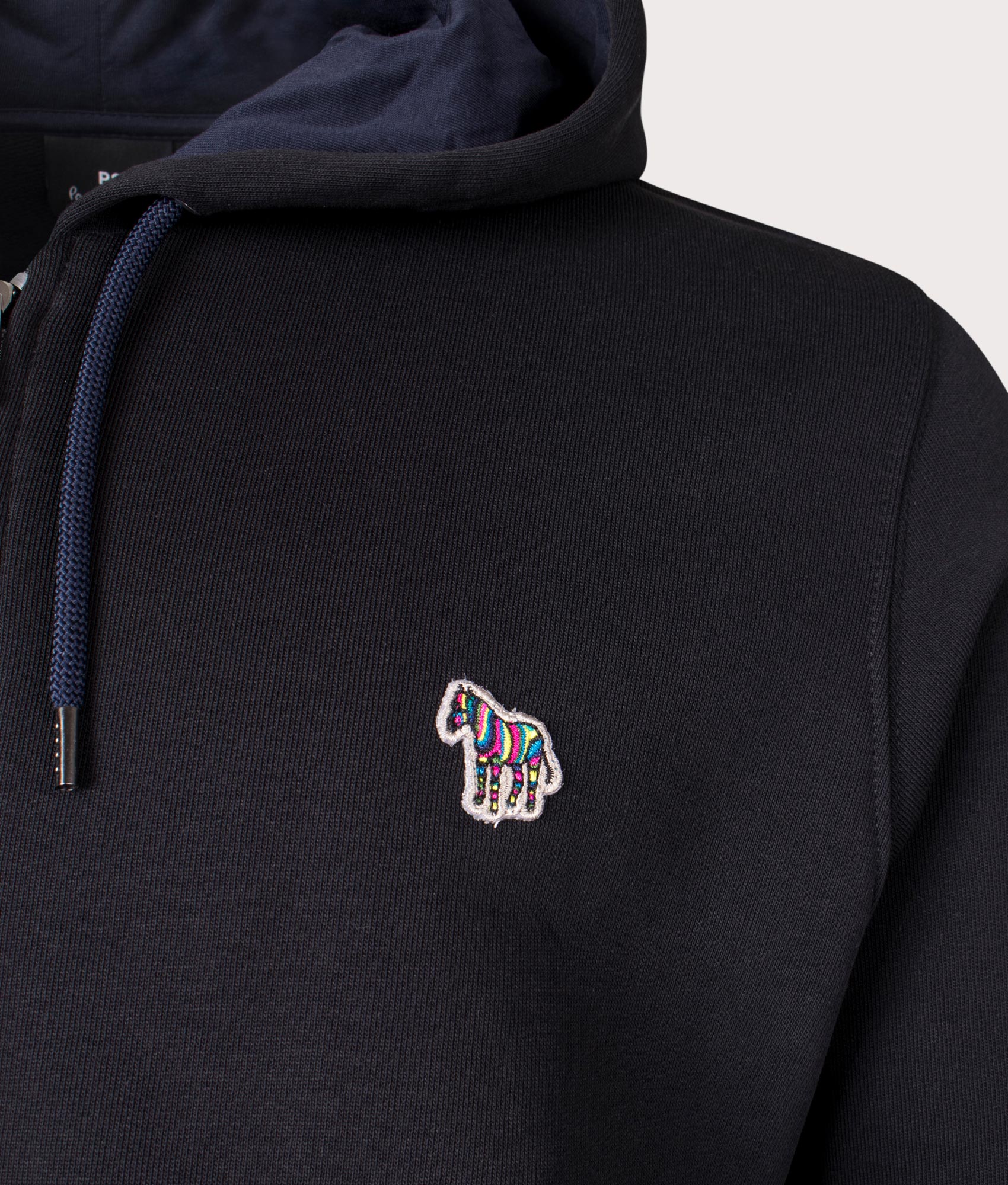 PS Paul Smith Zebra Logo Zip Through Hoodie in Black at EQVVS Menswear. Detail shot.
