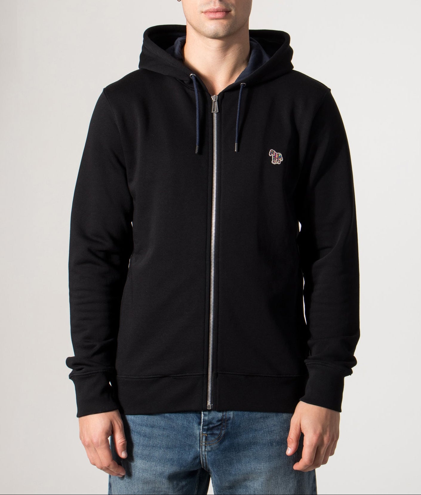 PS Paul Smith Zebra Logo Zip Through Hoodie in Black at EQVVS Menswear. Model front shot.