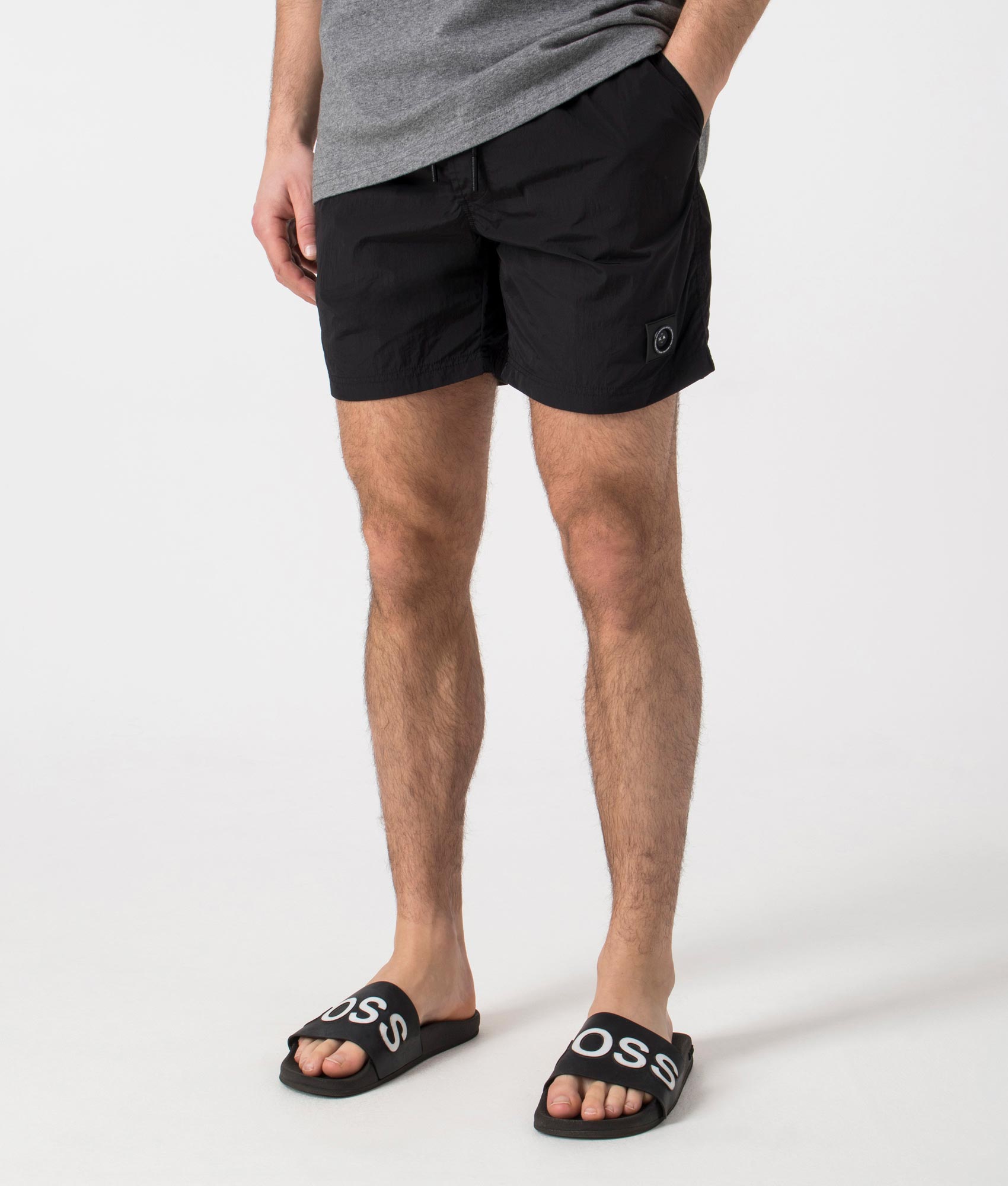 Marshall Artist Krinkle Nylon Siren Swim Shorts in Black. Side angle shot at EQVVS.