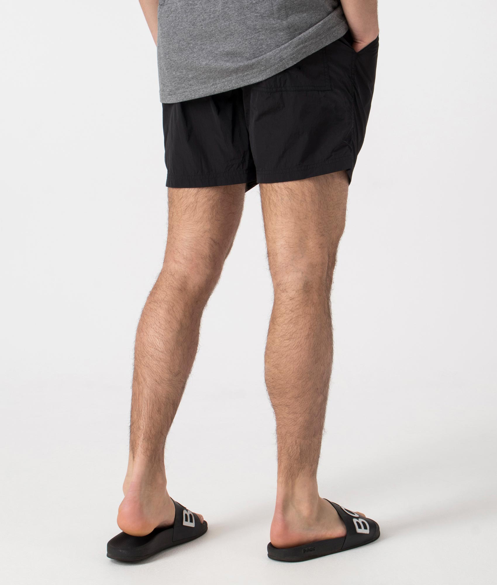 Marshall Artist Krinkle Nylon Siren Swim Shorts in Black. Back angle shot at EQVVS.