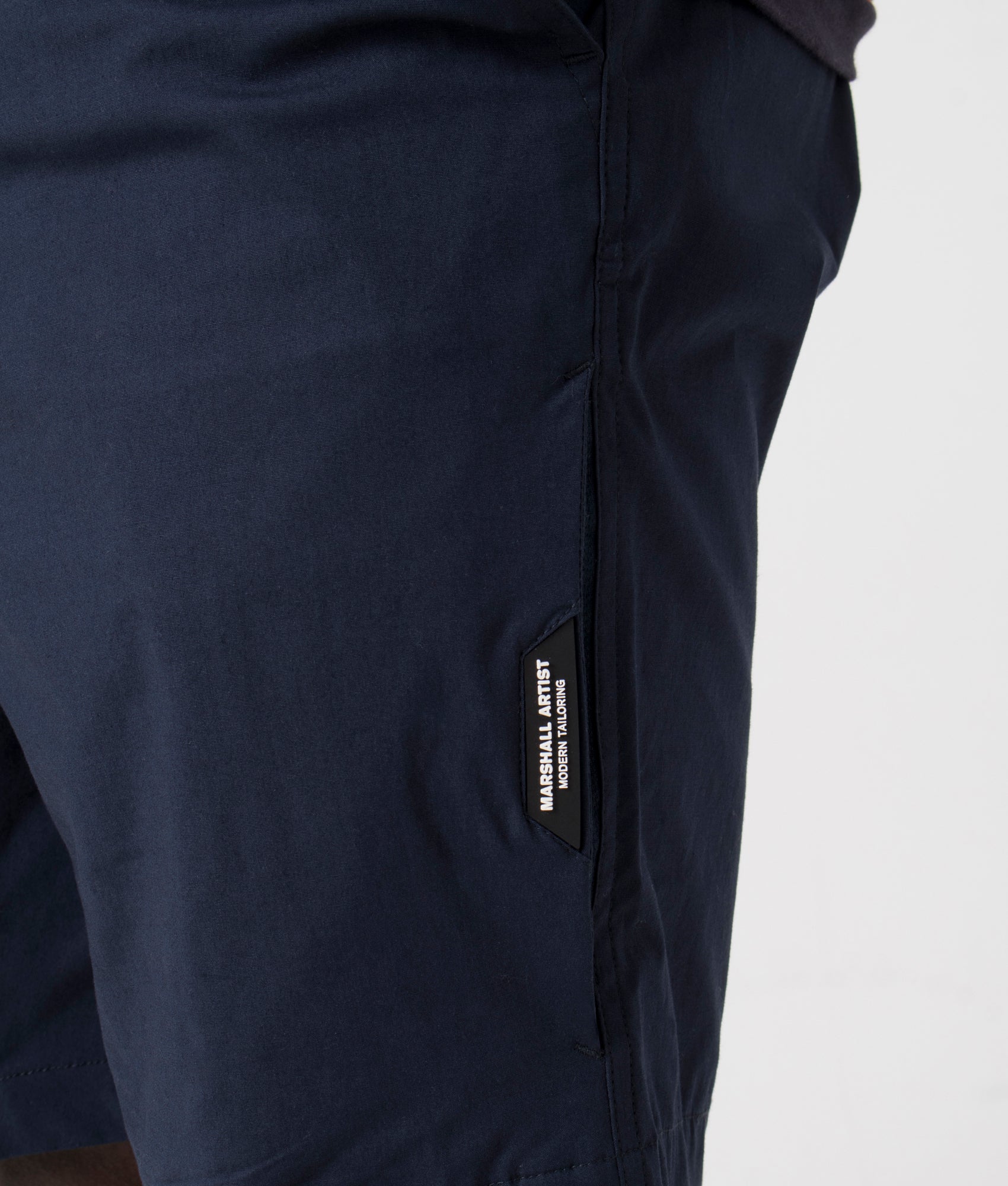 Frenzo Shorts in Navy by Marshall Artist. EQVVS Detail Shot.
