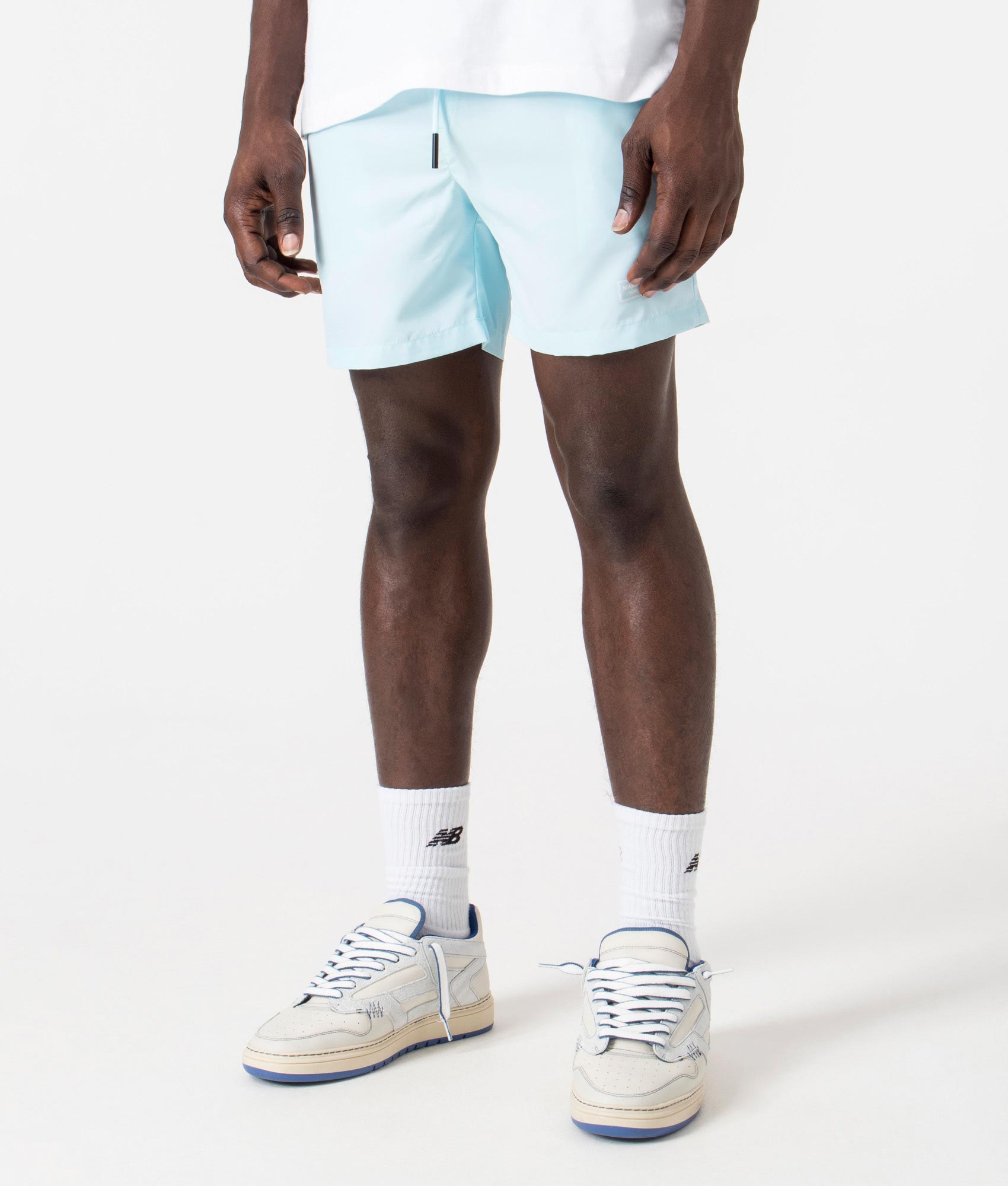 Signature Swim Shorts in Sky Blue by Marshall Artist. EQVVS Side Angle Shot.