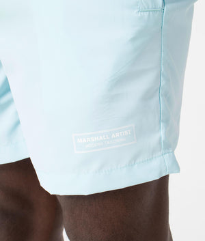 Signature Swim Shorts in Sky Blue by Marshall Artist. EQVVS Detail Shot.