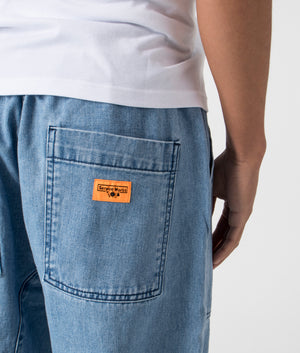 Service Works Denim Chef Pants in Light Washed Denim, 100% Cotton at EQVVS. Detailed Logo Shot. 