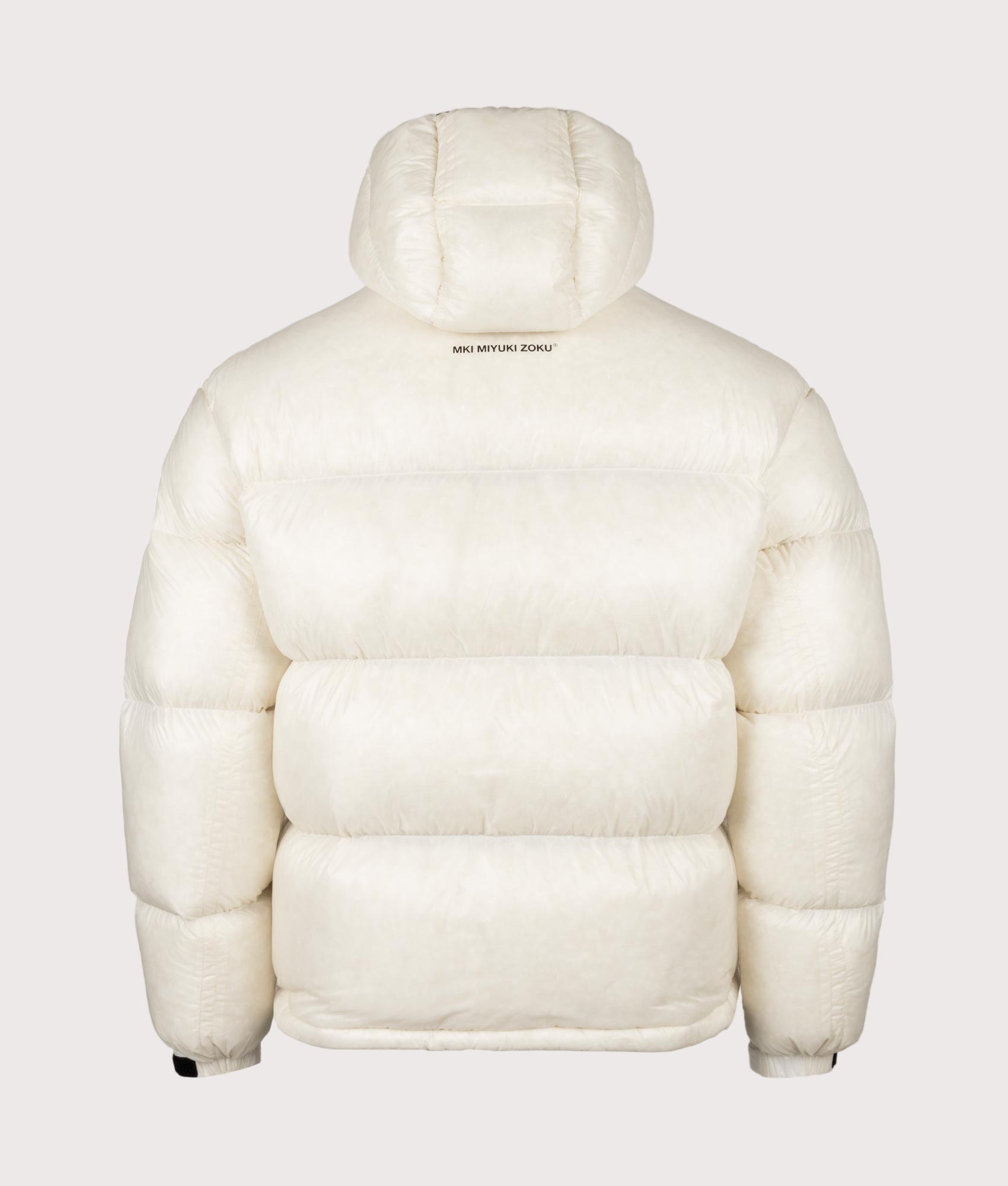 MKI MIYUKI ZOKU Translucent Bubble Jacket in Off White at EQVVS Menswear. Back shot.