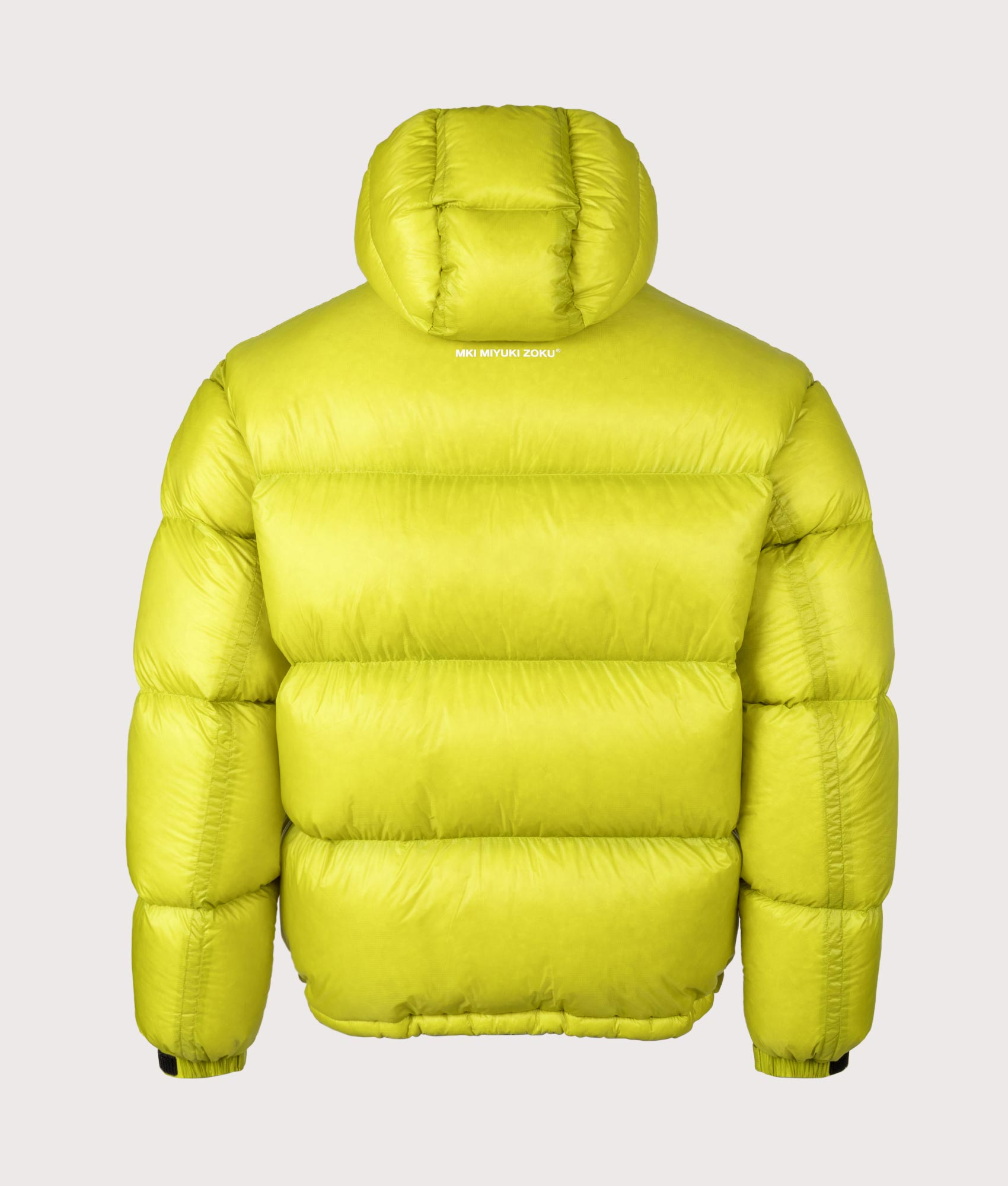 MKI MIYUKI ZOKU Translucent Bubble Jacket in Chartreuse at EQVVS Menswear. Back shot.