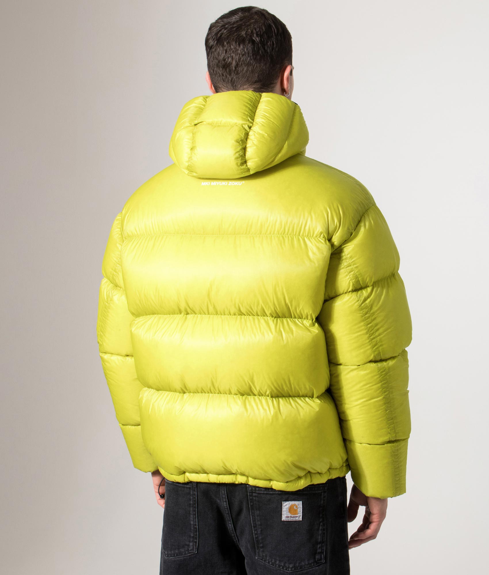 MKI MIYUKI ZOKU Translucent Bubble Jacket in Chartreuse at EQVVS Menswear. Back model shot