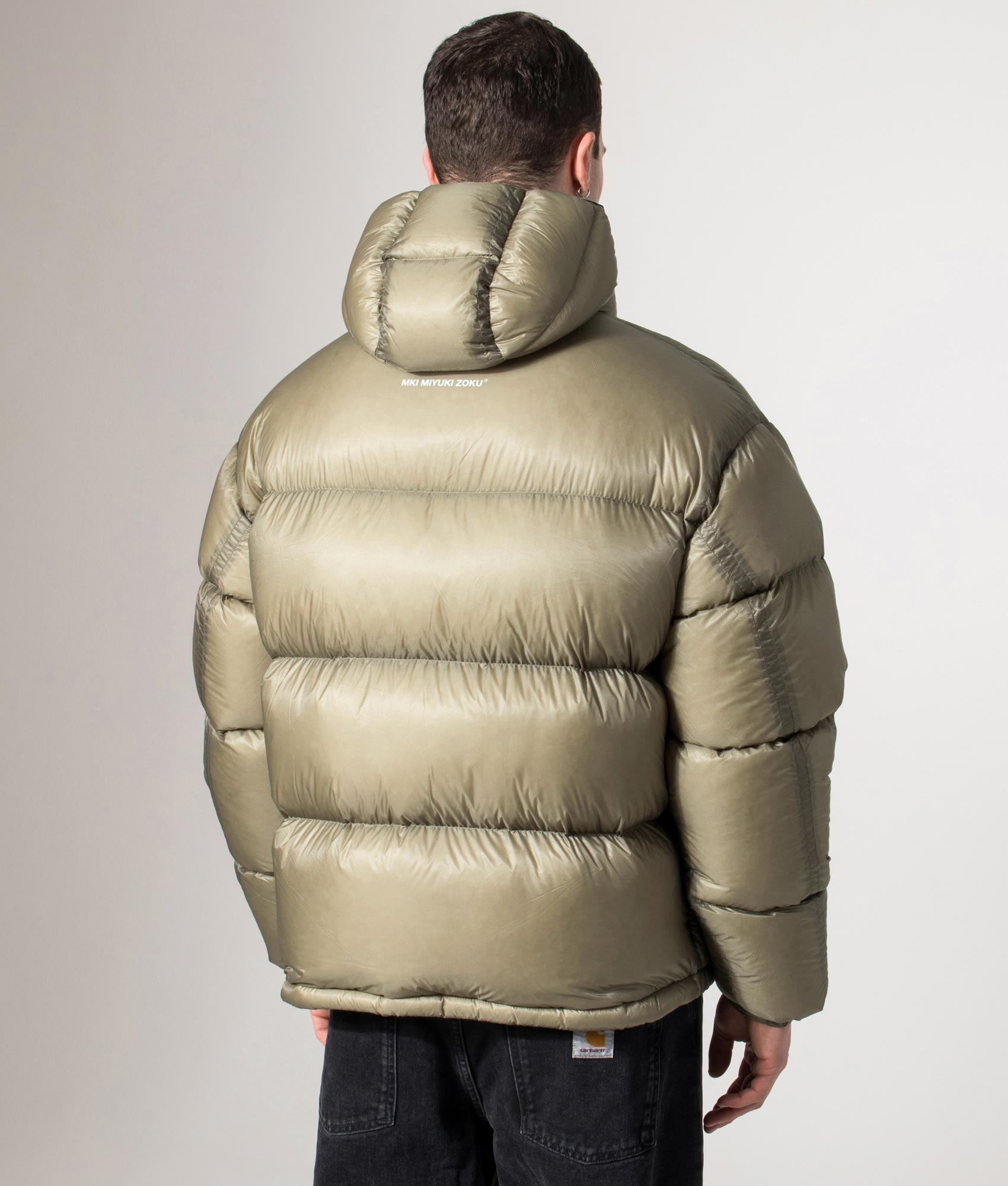 MKI MIYUKI ZOKU Translucent Bubble Jacket in Sage at EQVVS Menswear. Back model shot.