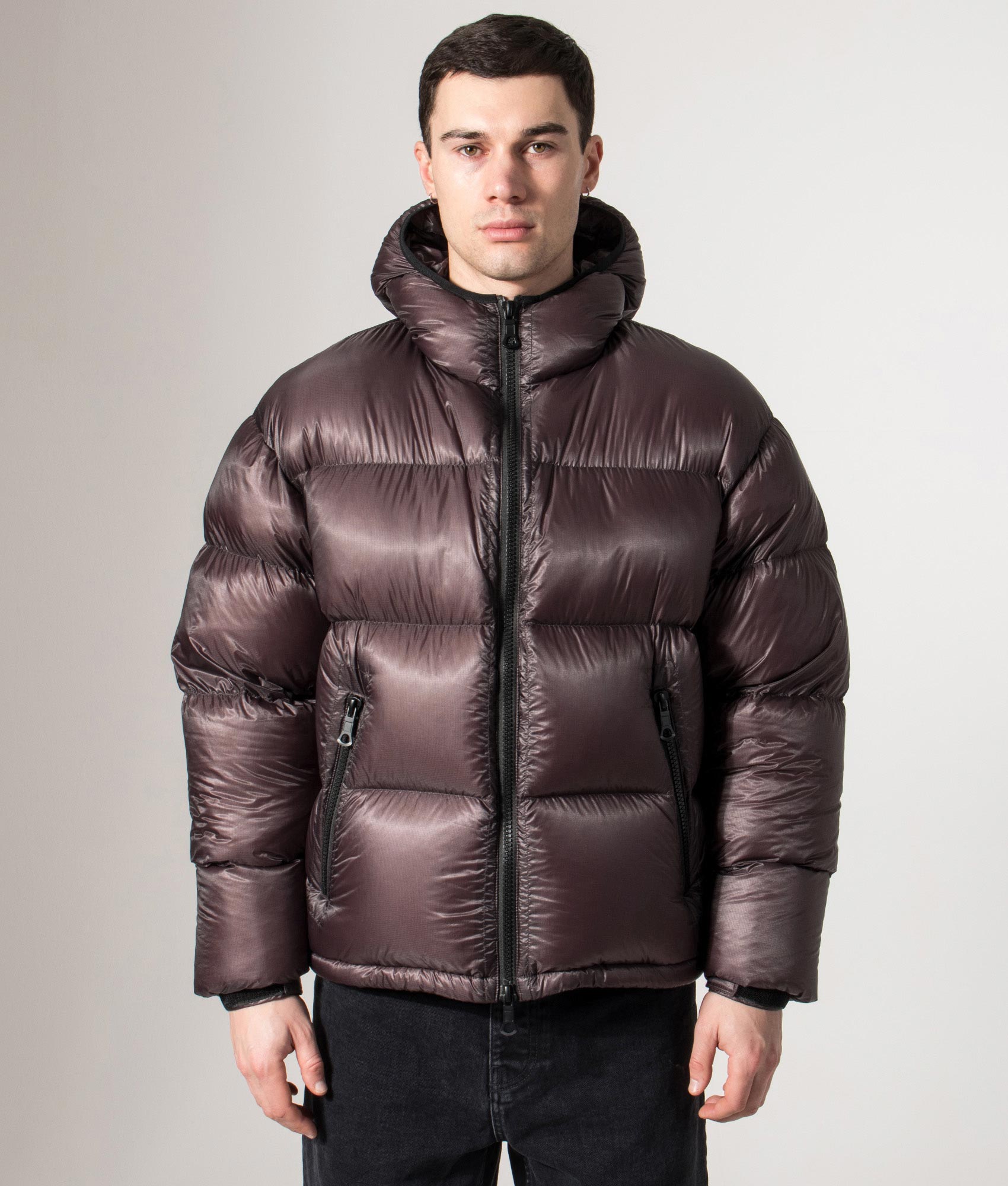 MKI MIYUKI ZOKU Translucent Hooded Bubble Jacket in Raisin at EQVVS Menswear. Front model shot.