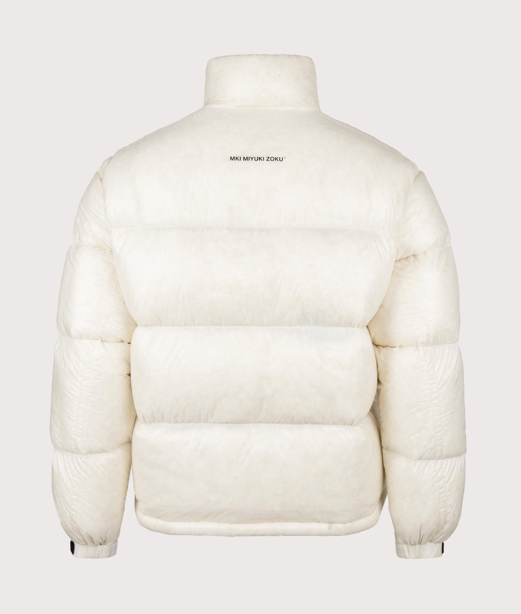 MKI MIYUKI ZOKU Translucent Funnel Neck Bubble Jacket in Off White at EQVVS Menswear. Back shot.