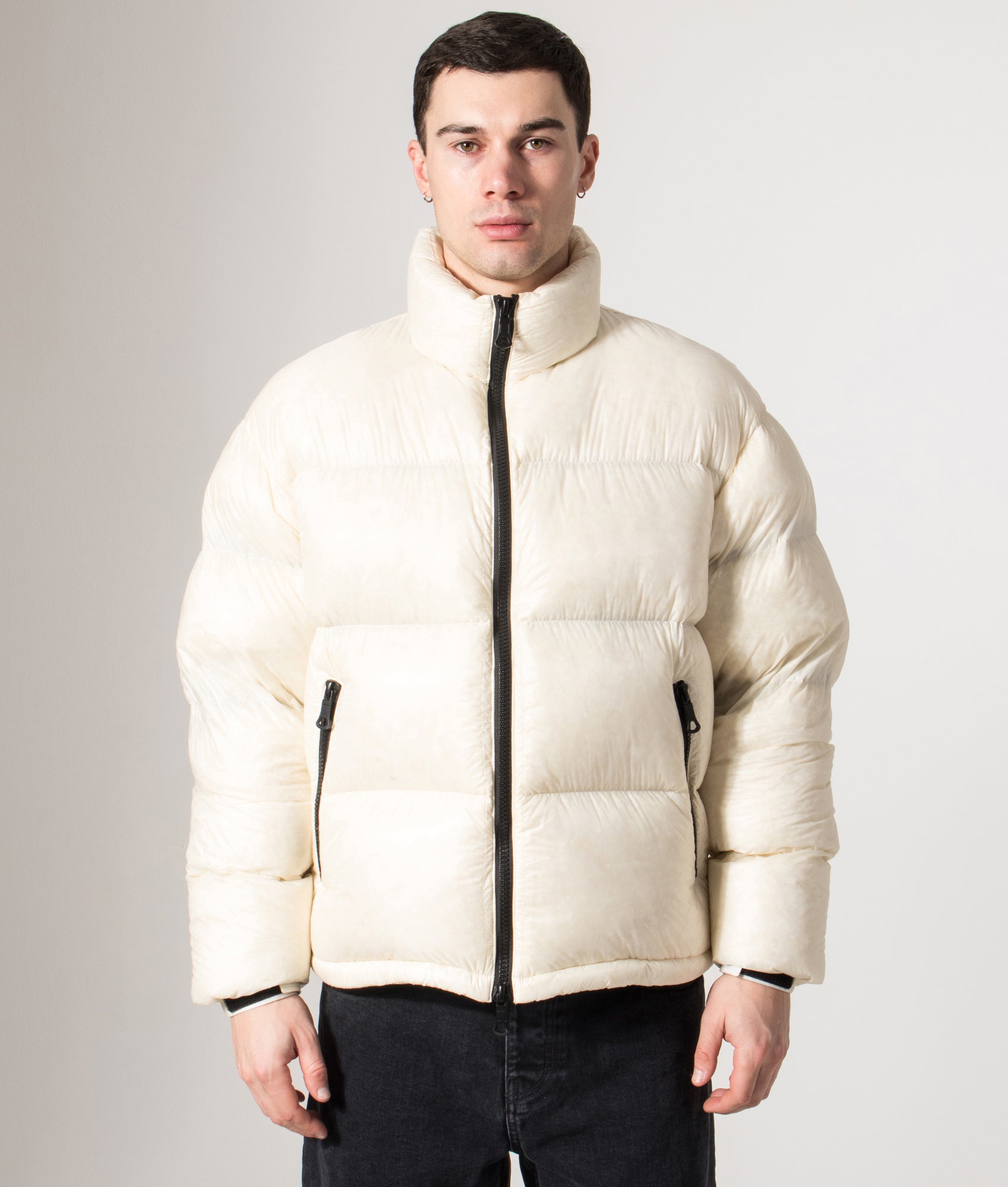 MKI MIYUKI ZOKU Translucent Funnel Neck Bubble Jacket in Off White at EQVVS Menswear. Front model shot.
