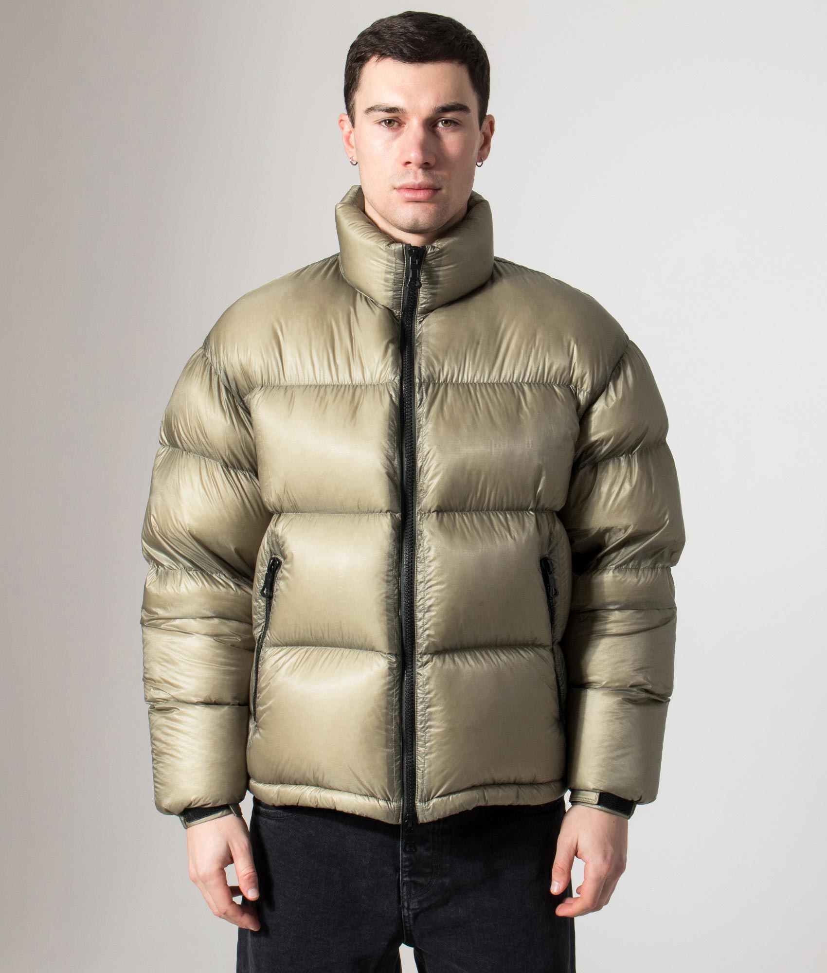 MKI MIYUKI ZOKU Translucent Funnel Neck Bubble Jacket in sage at EQVVS Menswear. Front model shot.