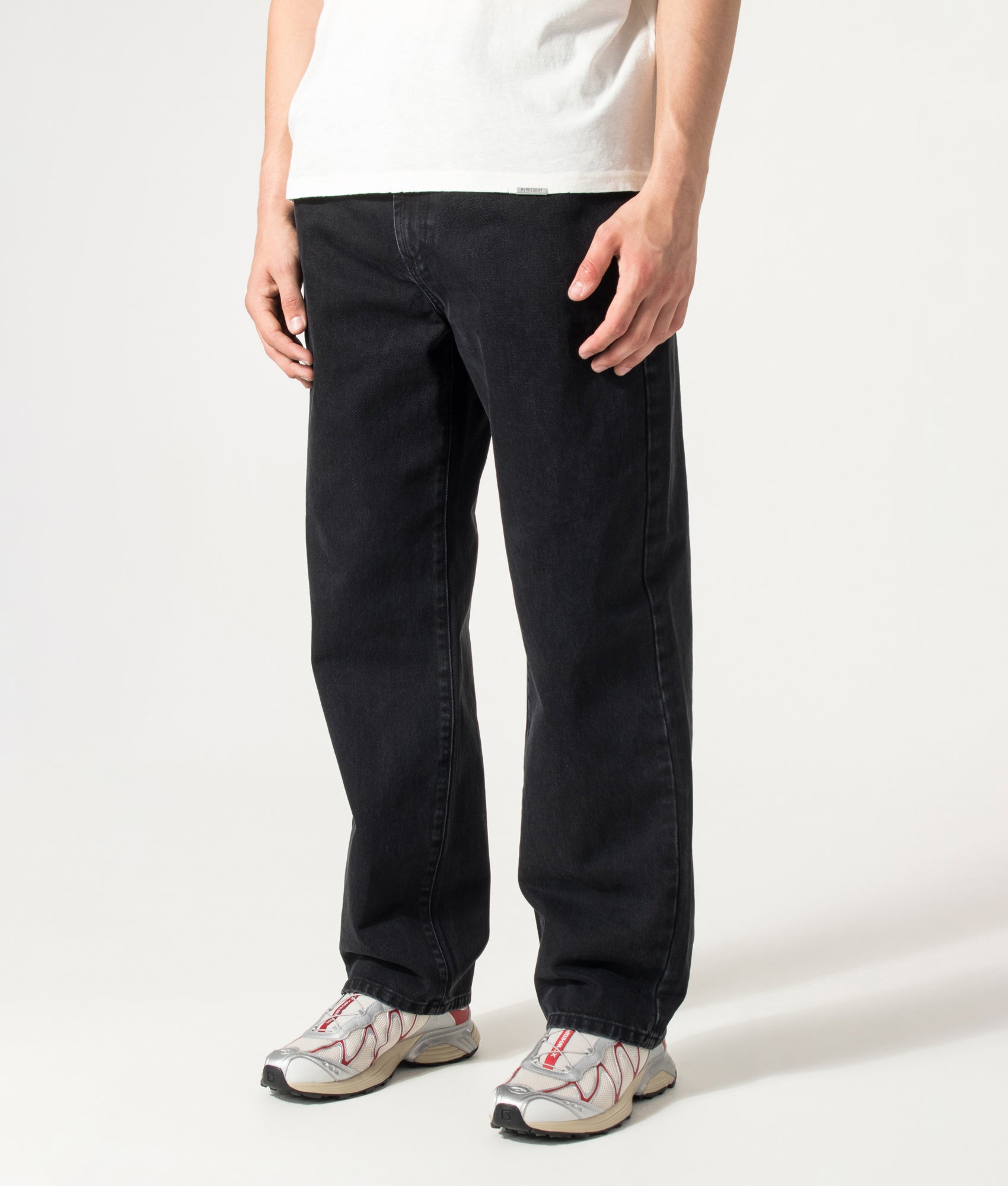 MKI MIYUKI ZOKU Denim Classic Jeans in Black Wash at EQVVS Menswear. Angled model front shot.