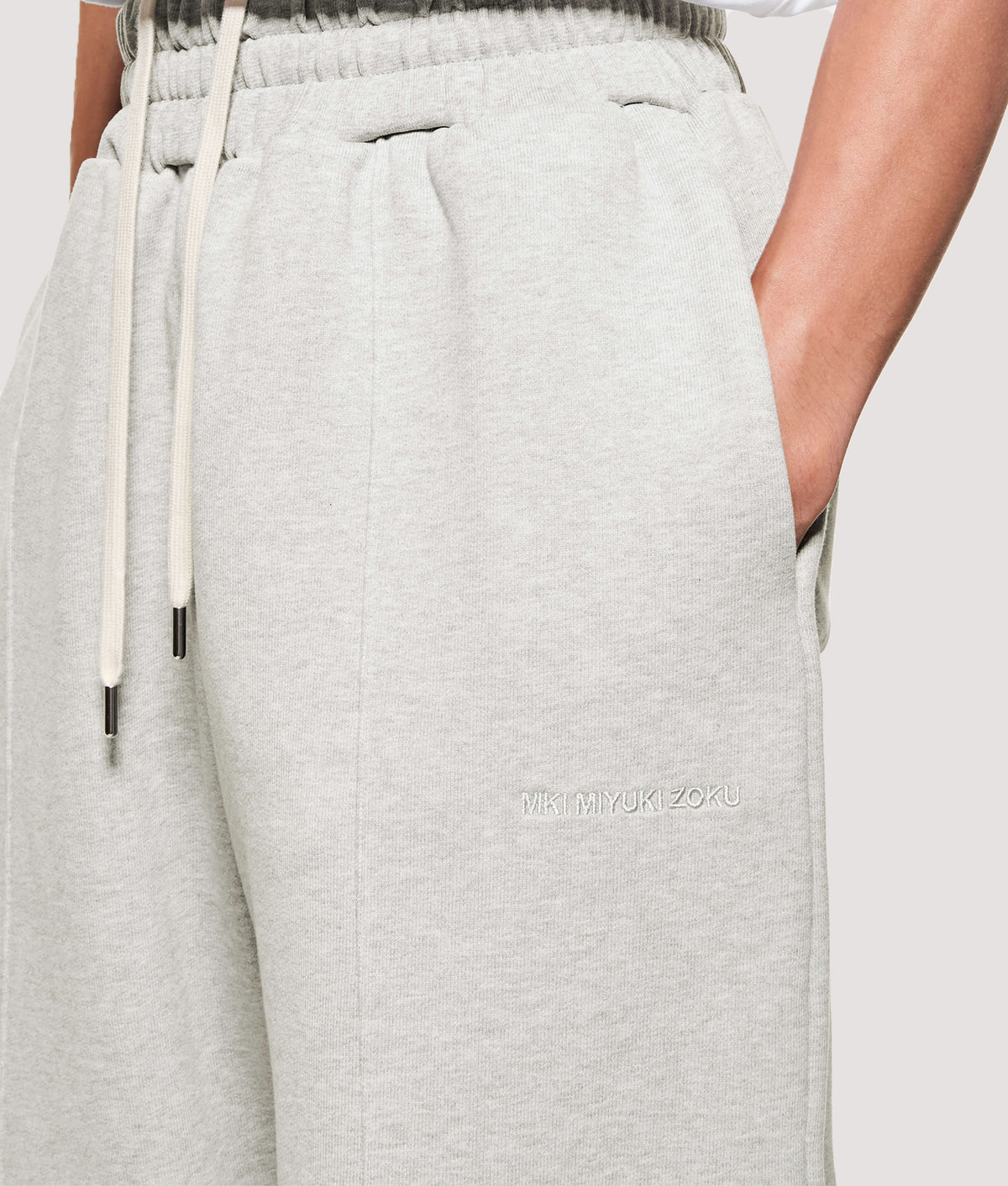 MKI MIYUKI ZOKU Relaxed Fit 800 GSM Superweight Wide Leg Joggers in Oatmeal at EQVVS Menswear. Detail shot.