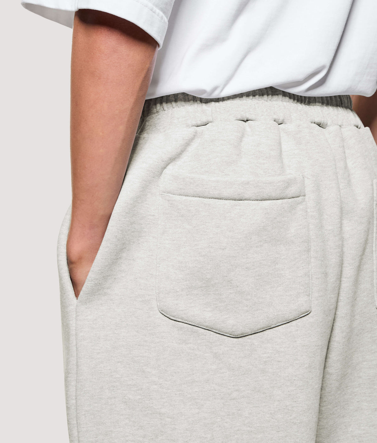MKI MIYUKI ZOKU Relaxed Fit 800 GSM Superweight Wide Leg Joggers in Oatmeal at EQVVS Menswear. Back detail shot.