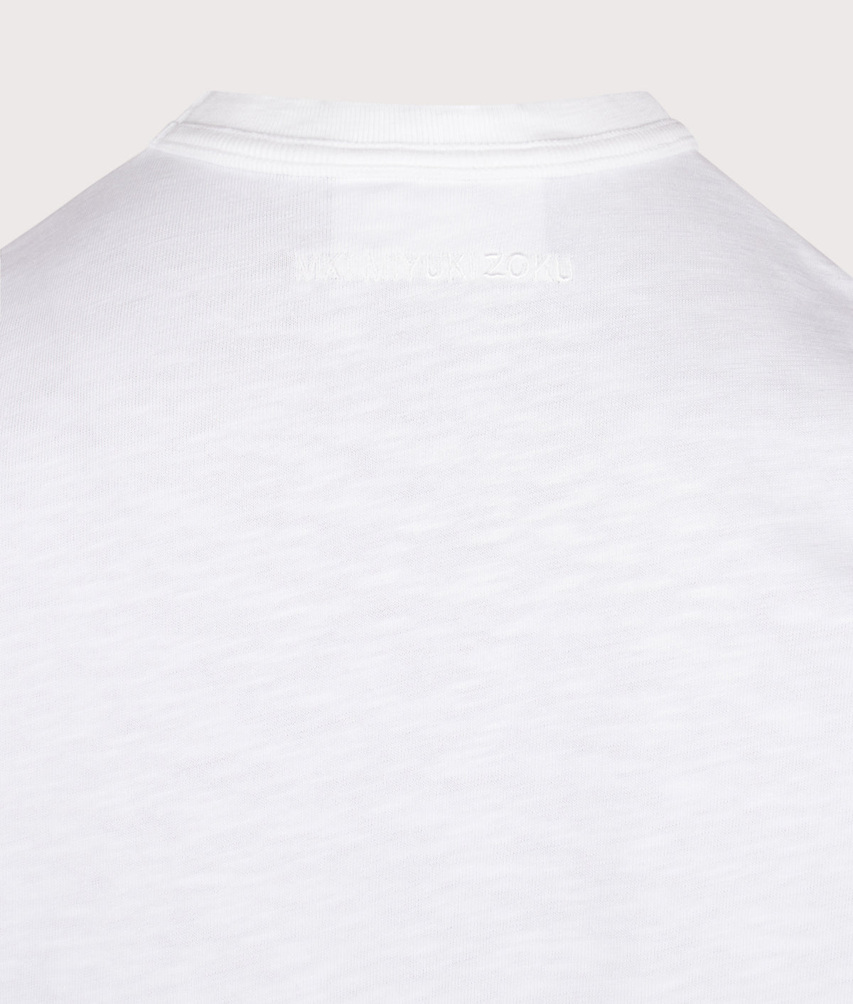 MKI MIYUKI ZOKU Relaxed Fit 220 GSM Slub Long Sleeve T-Shirt in White at EQVVS Menswear. Detail shot.