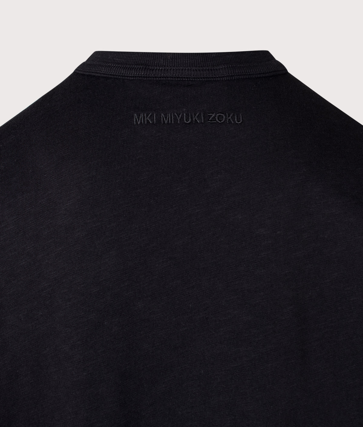 MKI MIYUKI ZOKU Relaxed Fit 220 GSM Slub Long Sleeve T-Shirt in Black at EQVVS Menswear. Detail shot.