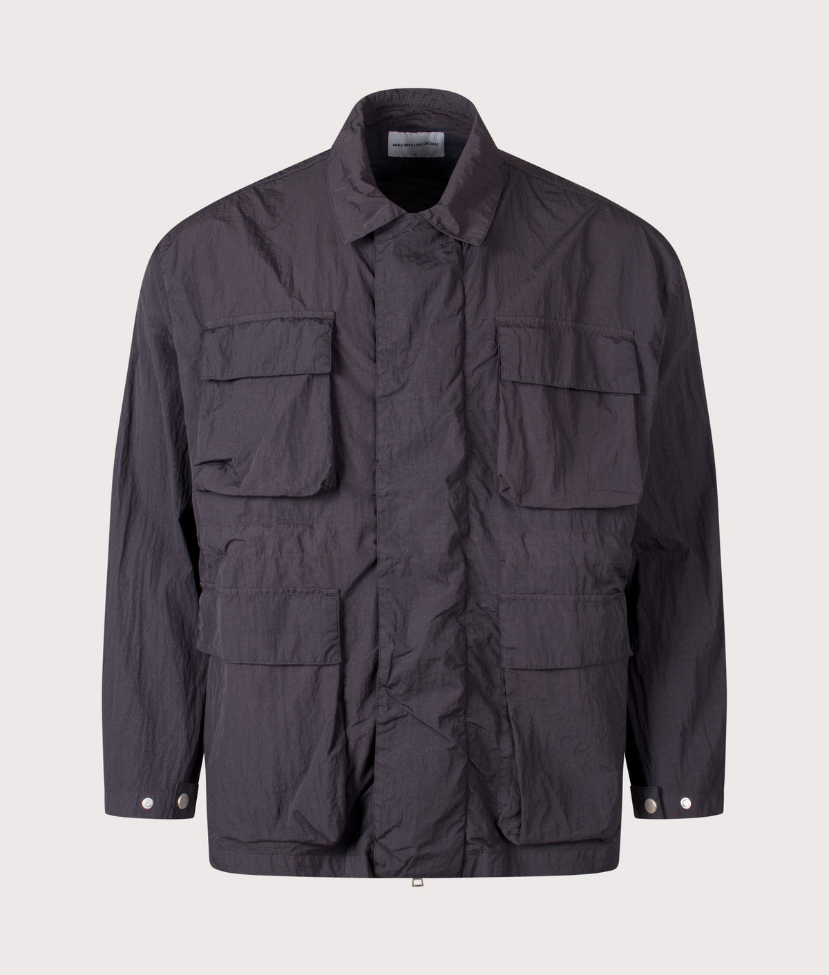 MKI MIYUKI ZOKU Relaxed Fit Garment Dyed Field Overshirt in Vintage Black at EQVVS Menswear. Front shot.
