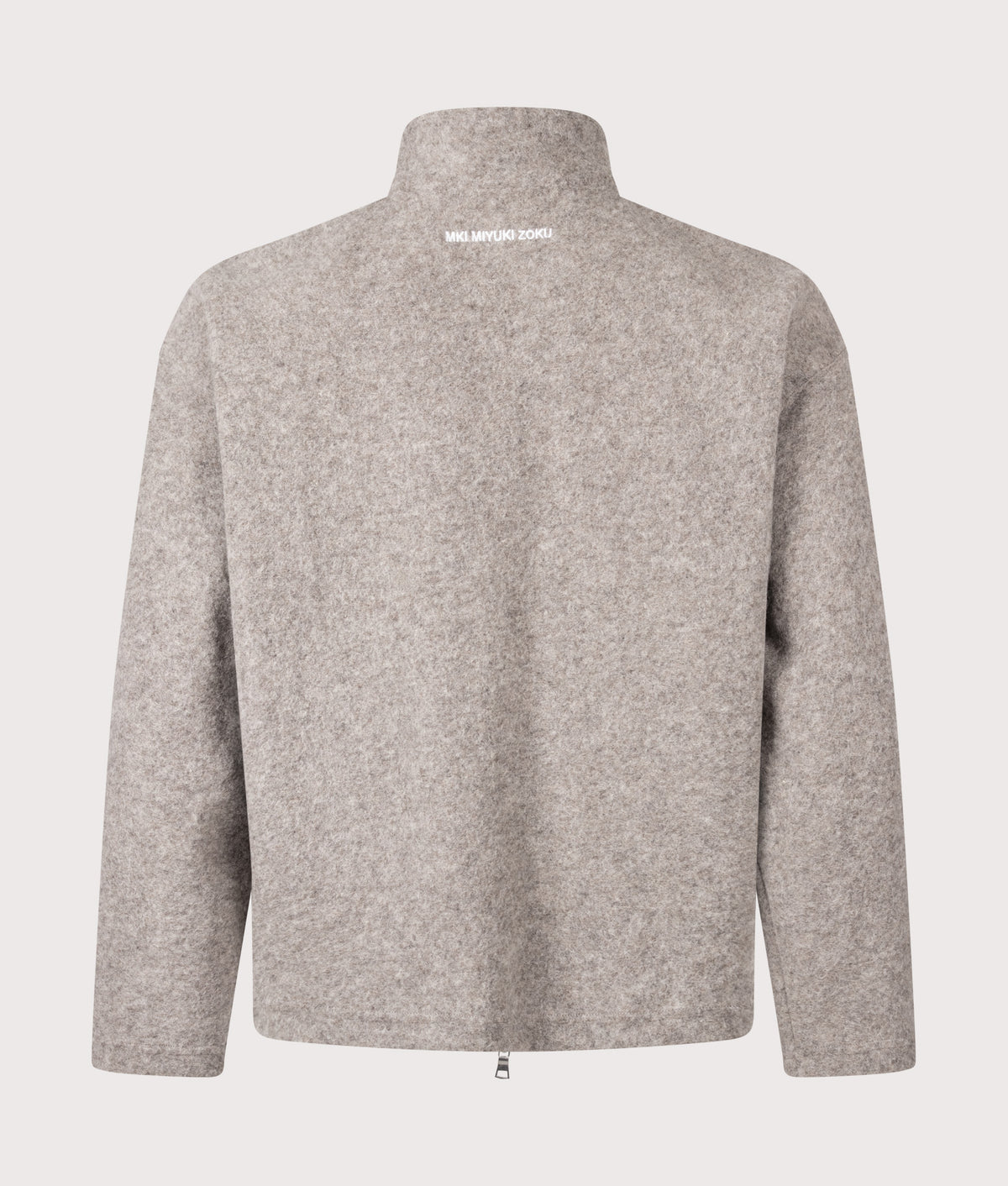 MKI MIYUKI ZOKU Relaxed Box Fit Pressed Wool Track Jacket in Oatmeal Melange at EQVVS Menswear. Back shot.