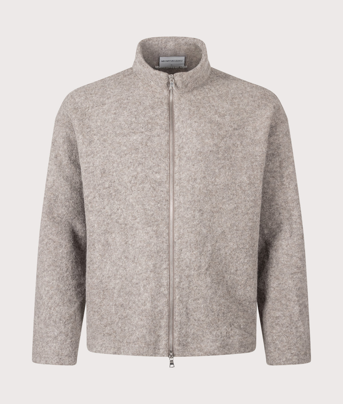 MKI MIYUKI ZOKU Relaxed Box Fit Pressed Wool Track Jacket in Oatmeal Melange at EQVVS Menswear. Front shot.