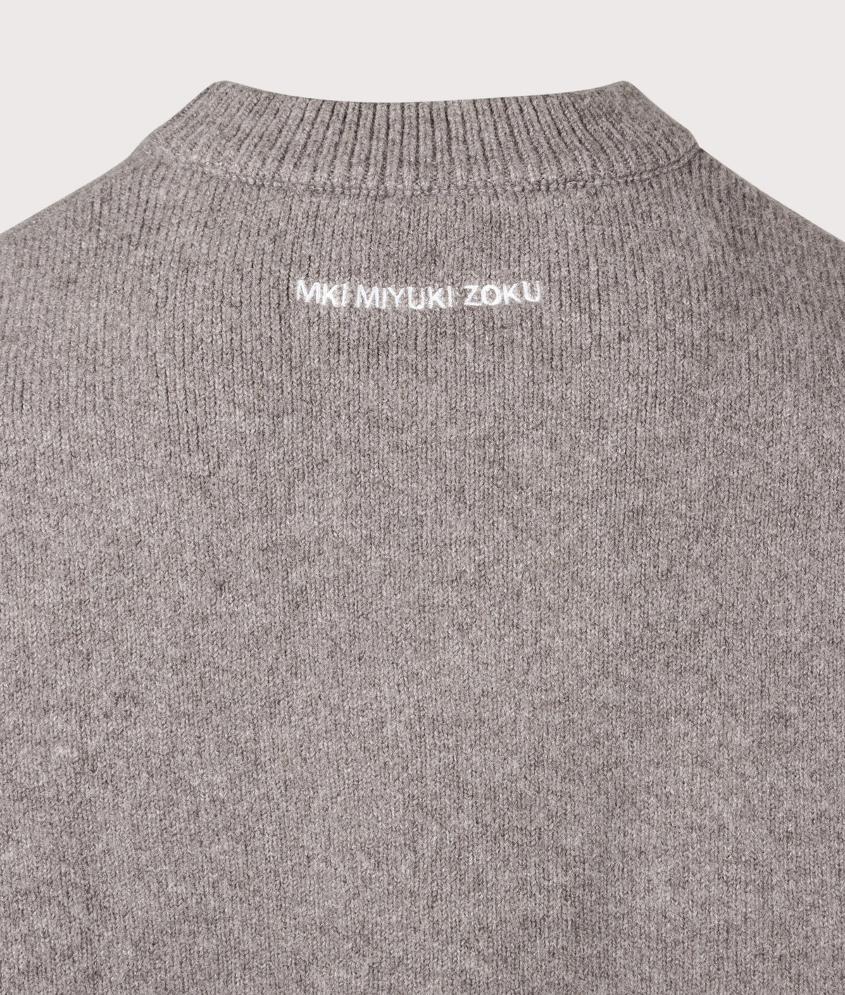 MKI MIYUKI ZOKU Relaxed Box Fit Double Knit Crewneck Jumper in Brown at EQVVS Menswear. Detail shot.