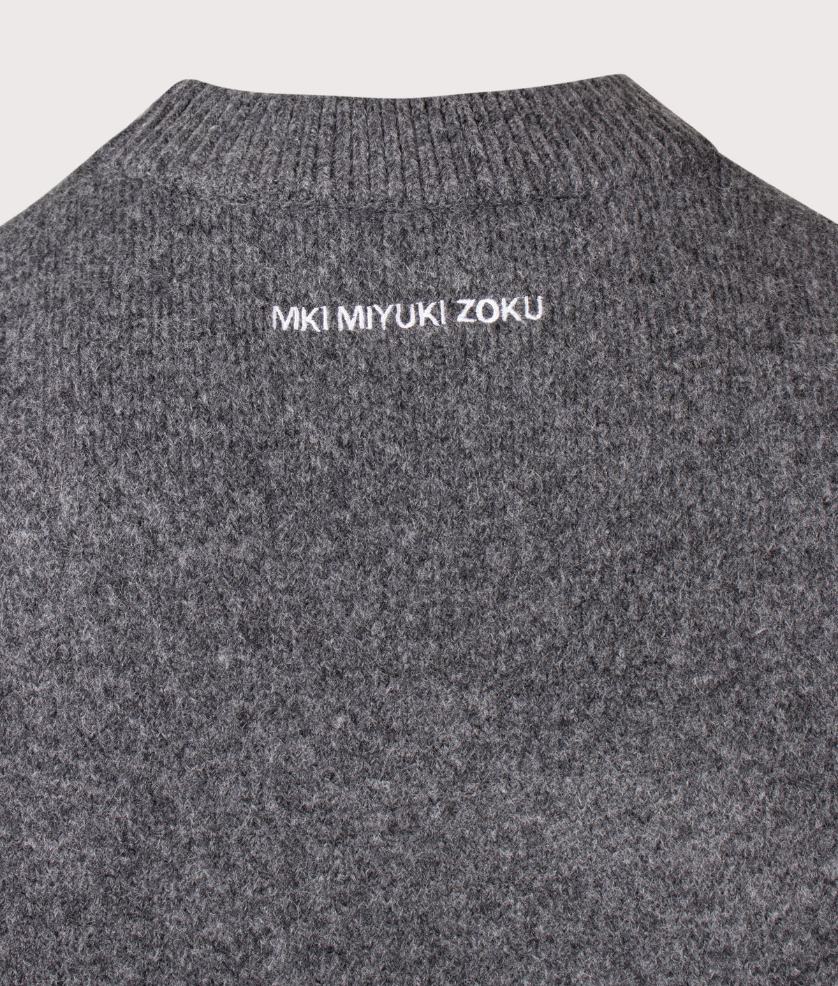 MKI MIYUKI ZOKU Relaxed Box Fit Double Knit Crewneck Jumper in Charcoal at EQVVS Menswear. Detail shot.