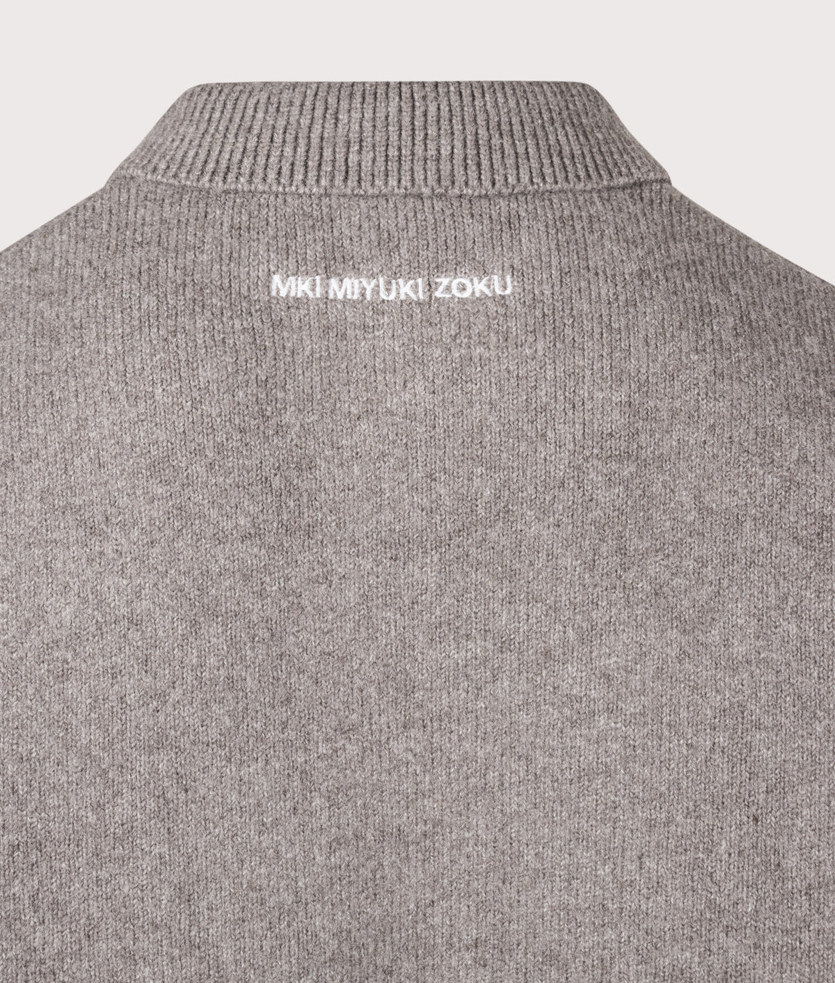 MKI MIYUKI ZOKU Relaxed Box Fit Double Knit Rugby in Brown at EQVVS Menswear. Detail shot.